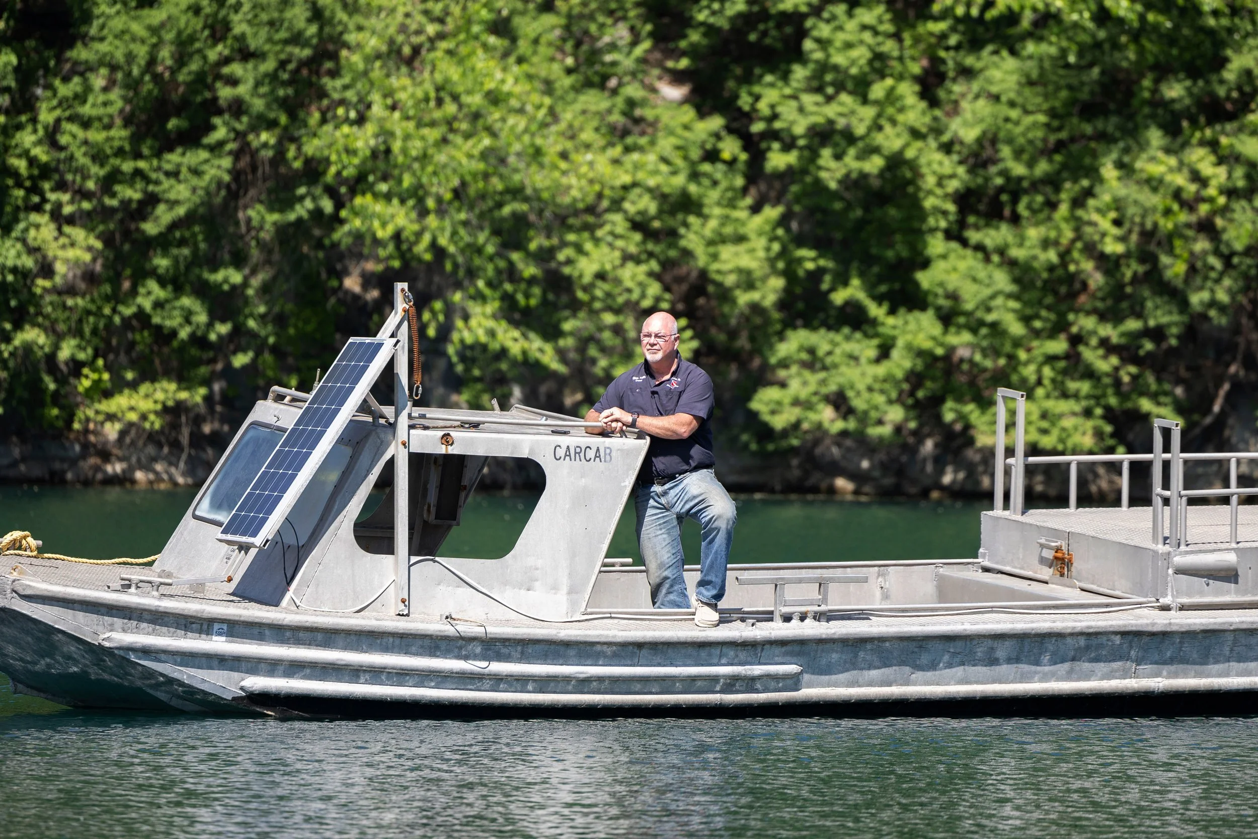 Co-owner of Mermet Springs Glen Faith poses for a portrait on the training boat stationed in the middle of the quarry April 23, 2026 at Mermet Springs in Belknap, Illinois.