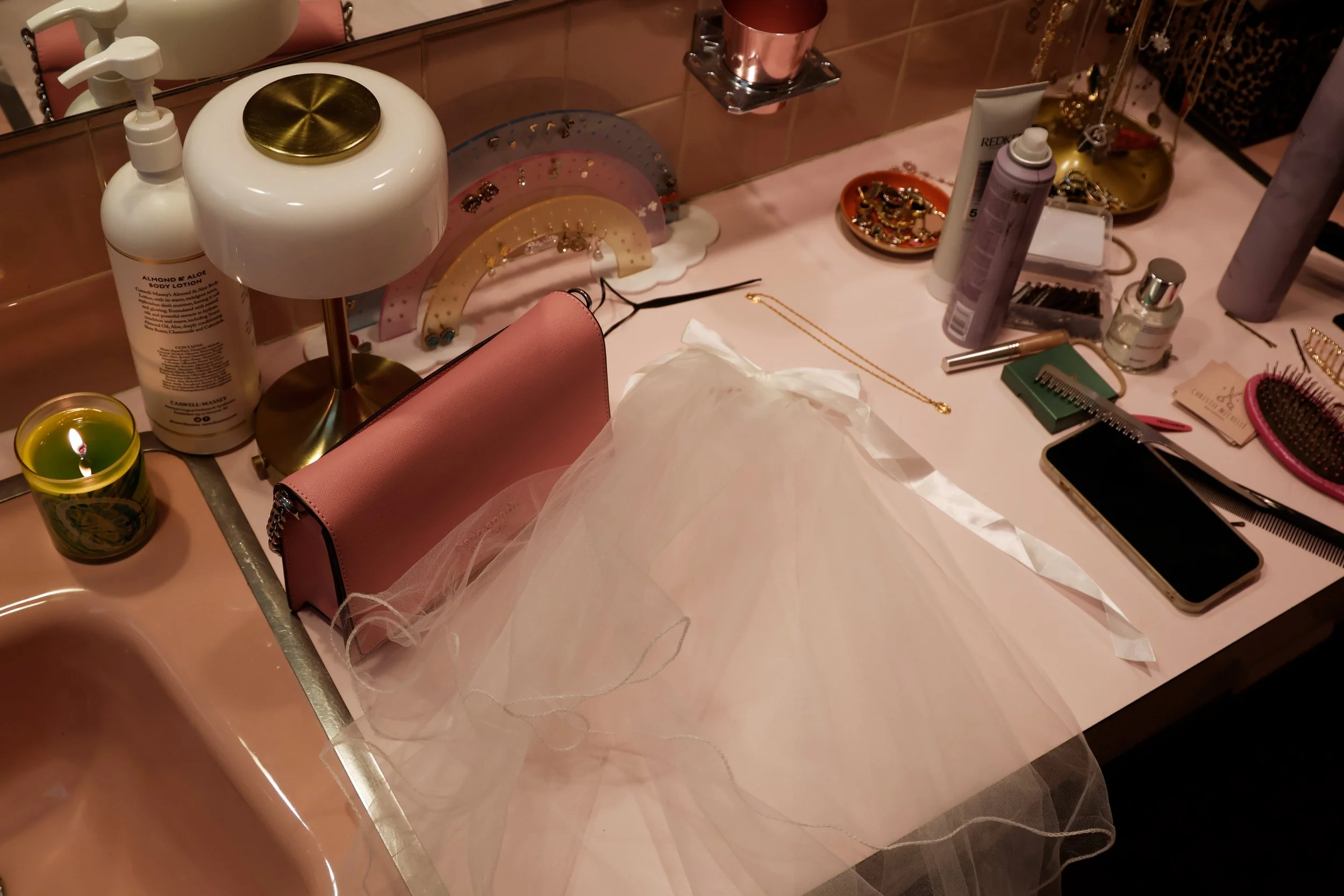 A veil, makeup and hair products sit on the bathroom counter April 11, 2026 in Murphysboro, Illinois. 