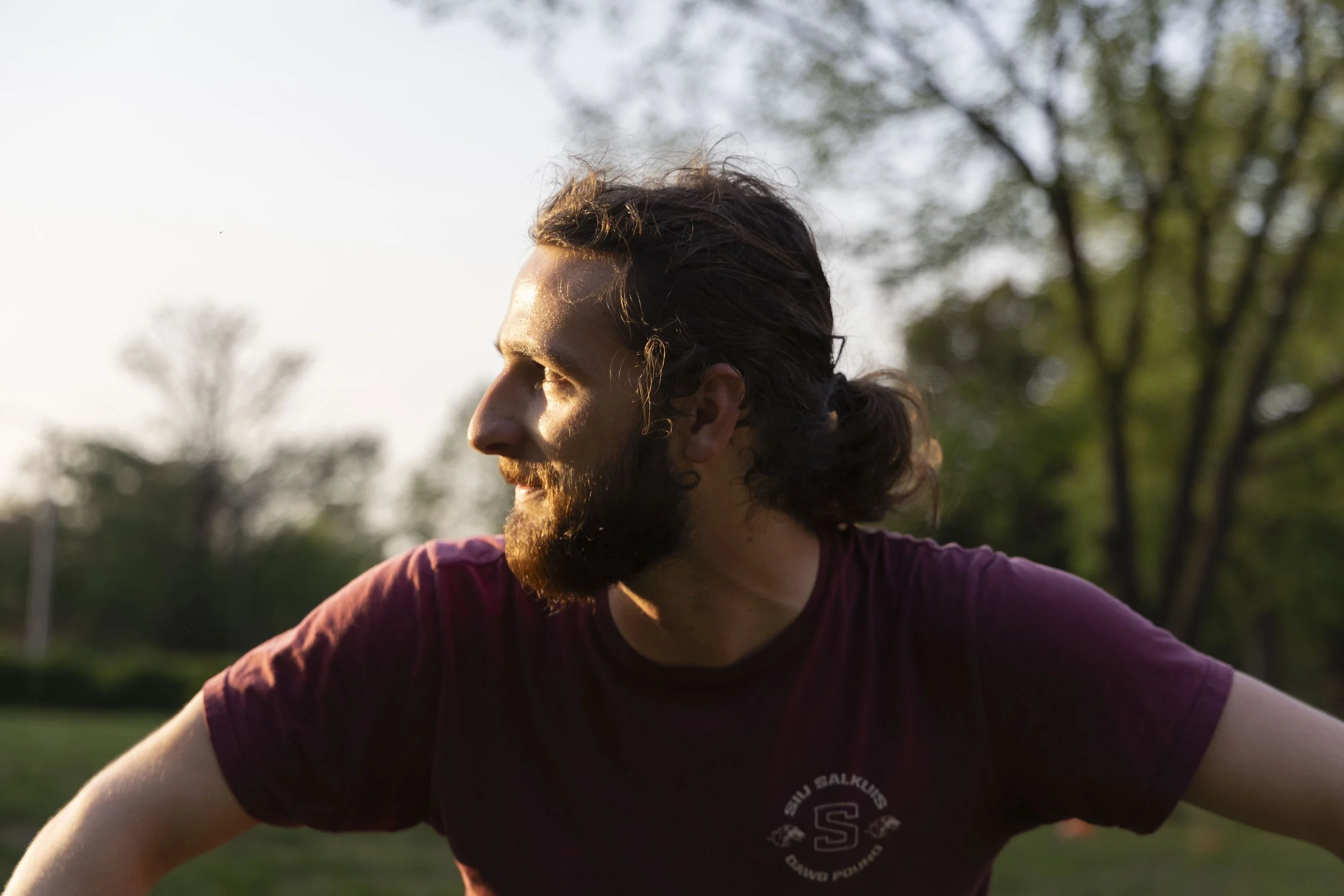 Ethan Whittaker looks towards another club member at practice April 14, 2026 in front of Morris Library in Carbondale, Illinois. 