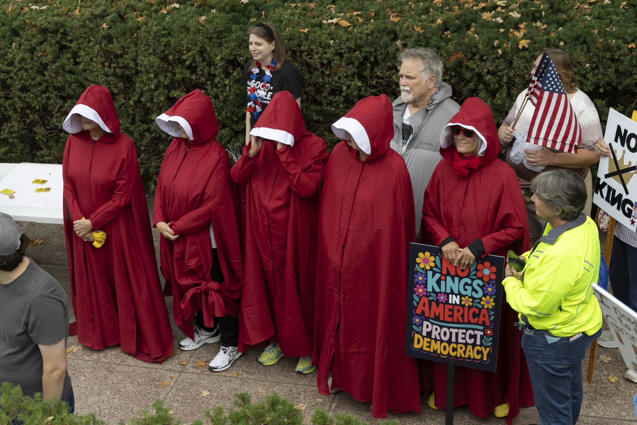 A group of women dress up as handmaids from “The Handmaid’s Tale” at the No Kings protest Oct. 18, 2025 in front of the Illinois State Capitol in Springfield, Illinois.