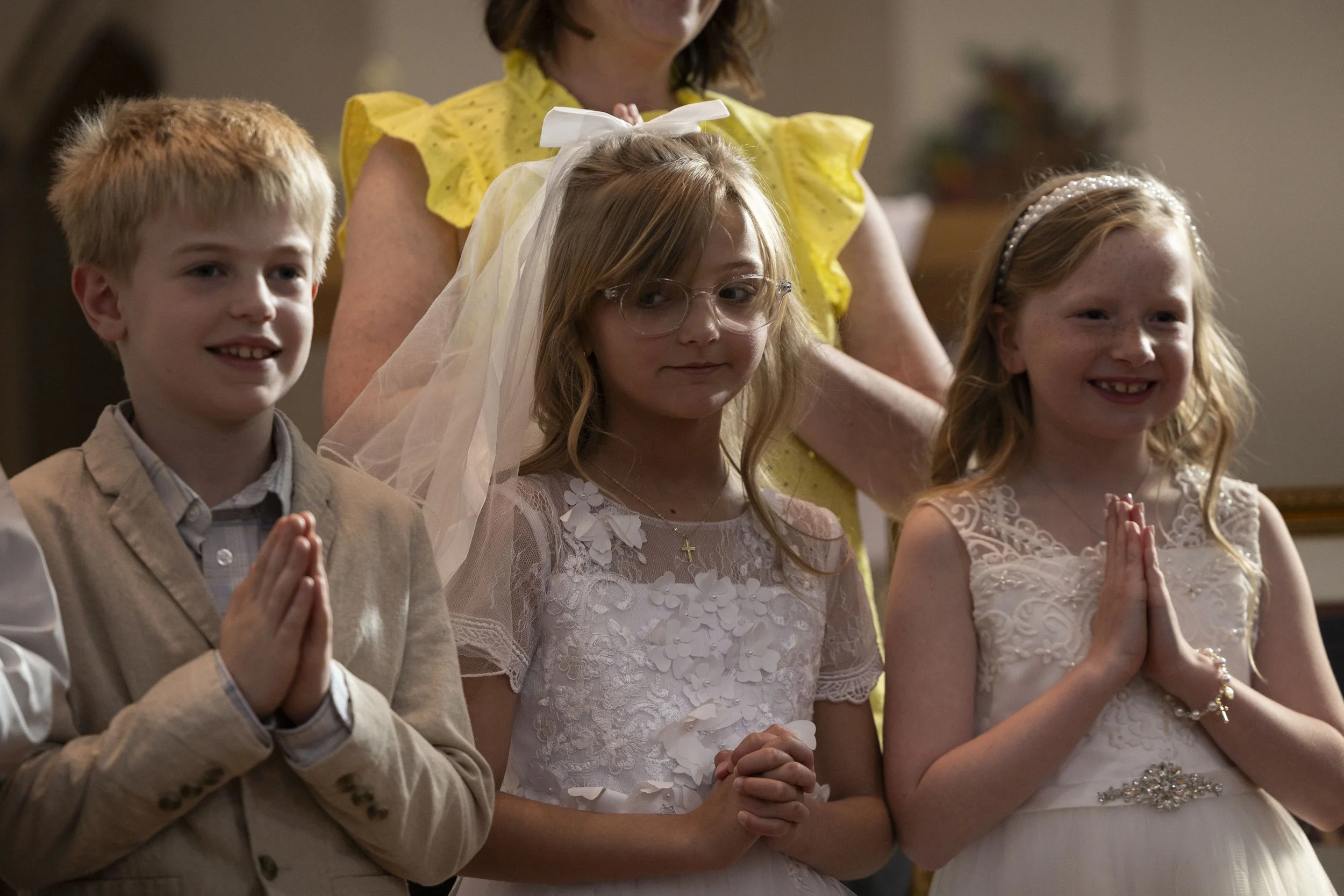 Marcella Haney looks towards Victor Cummings during her first Communion April 11, 2026 at St. Andrew’s Catholic Church in Murphysboro, Illinois. 