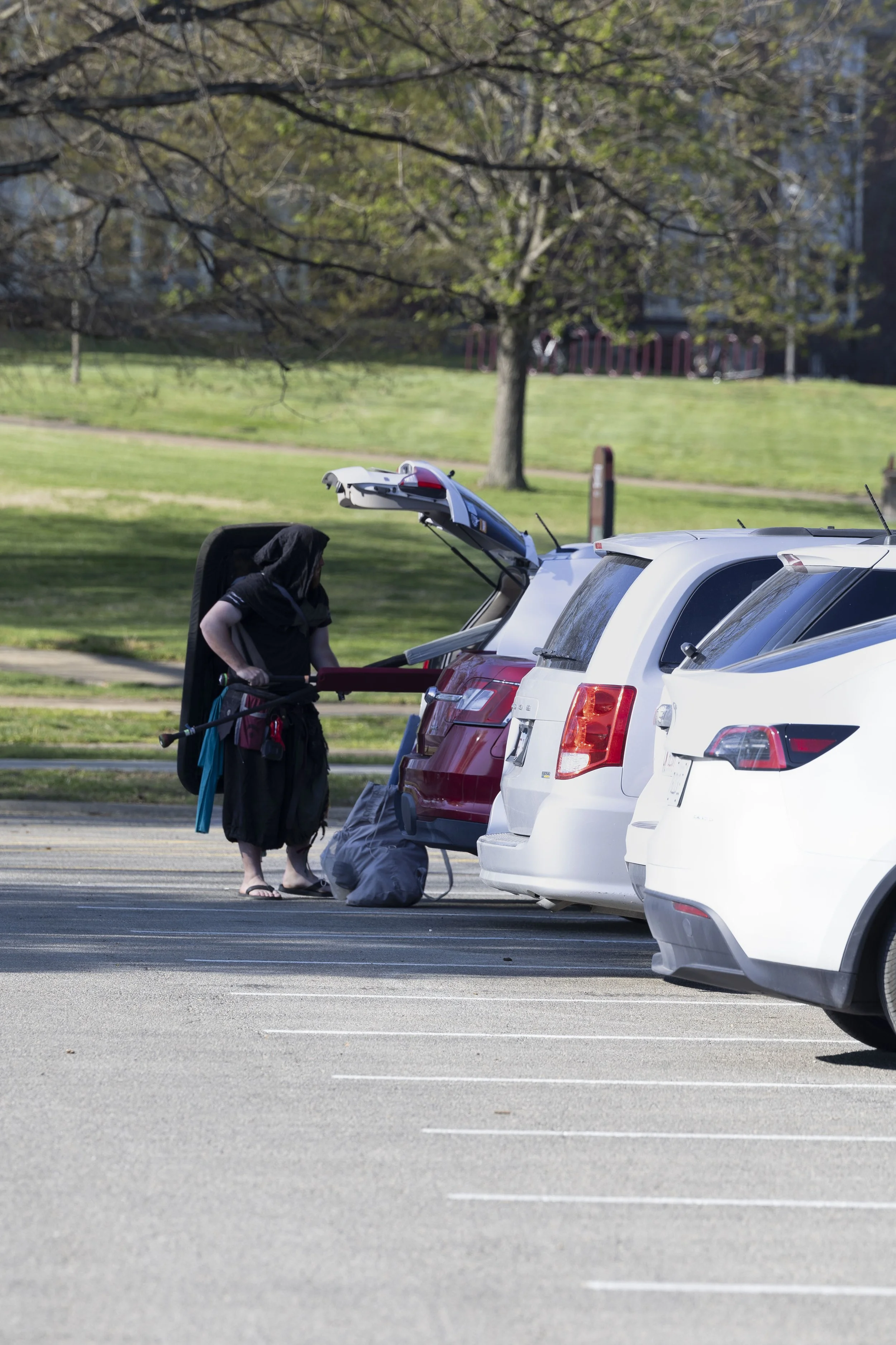 Ashton Reedy (Scarab) grabs his weapons out of his trunk to bring to practice April 7, 2026 at the Morris Library parking lot in Carbondale, Illinois. 