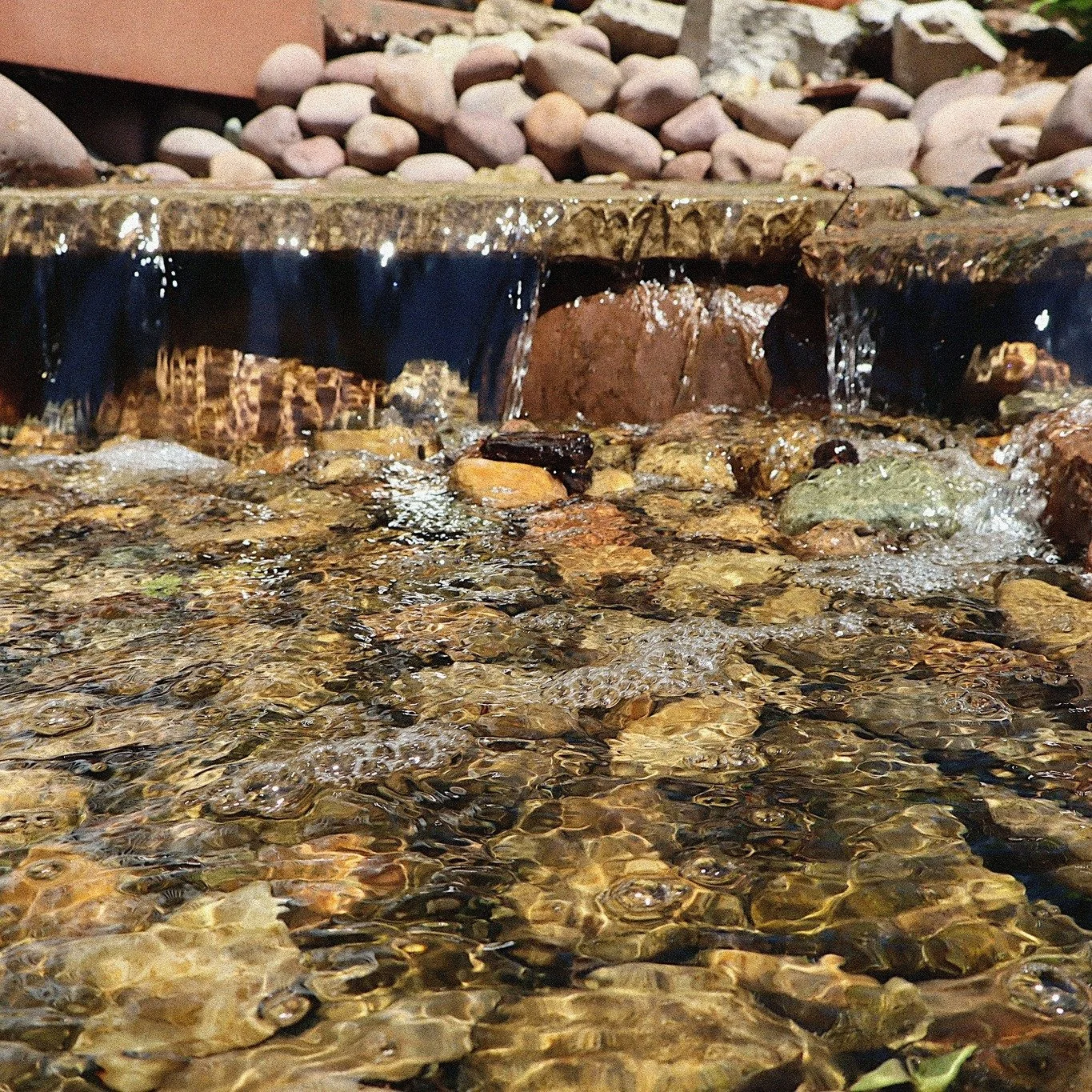 Nothing like the sound of a waterfall and seeing our freshly planted flowers while enjoying your favorite glass of DRV wine. See you soon!