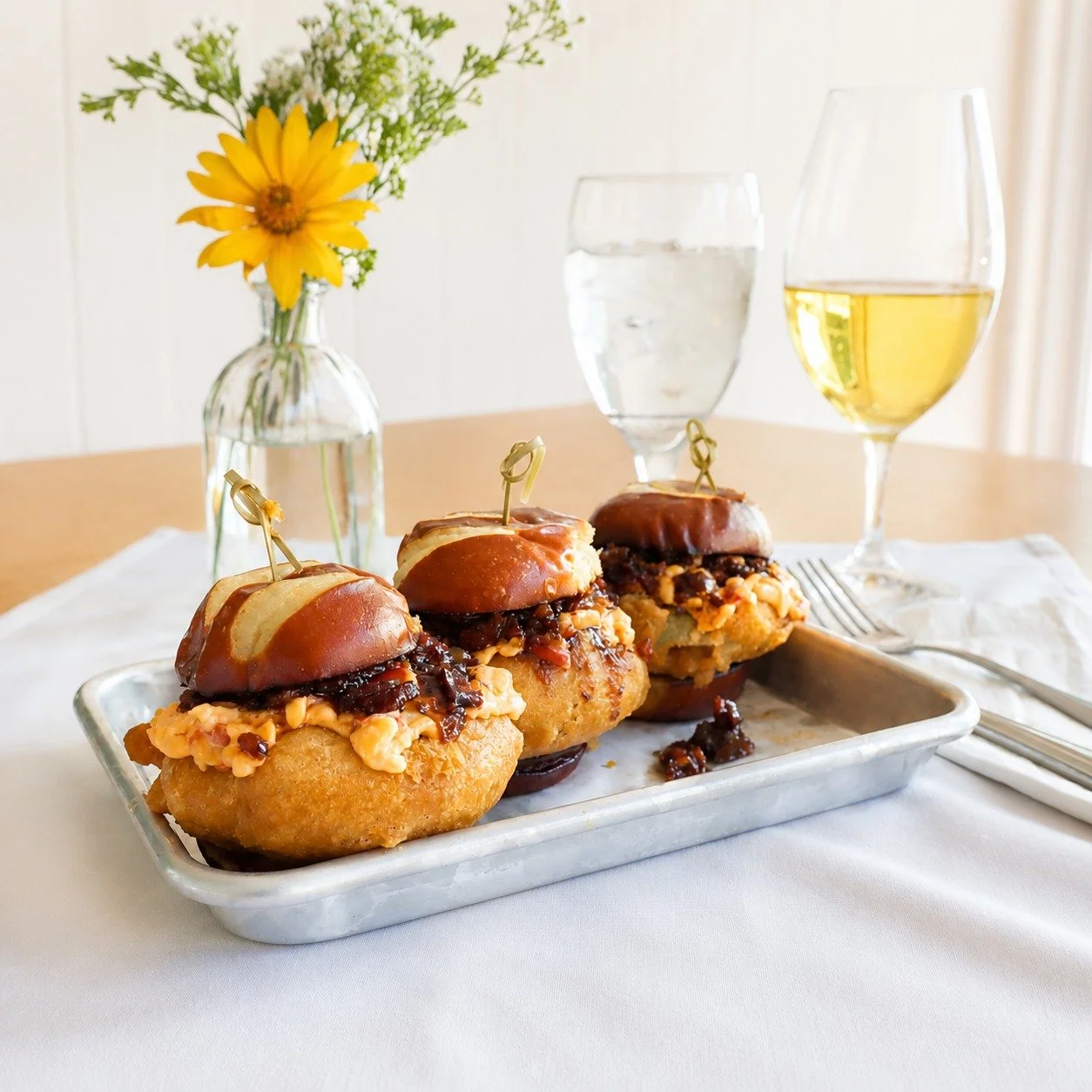 Dinner specials tonight: 

Appetizer ~ Delicious Green Tomato Sliders, topped with house-made pimento cheese and bacon jam, served on a pretzel bun - fresh from the garden! 🍅

Entree ~ Cajun Chicken Pasta which pairs perfectly with our Off-Dry Vigno