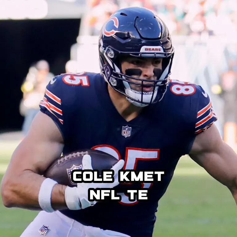 A football player in a dark blue Chicago Bears uniform holding a football, wearing a helmet with the Bears logo, on a football field.