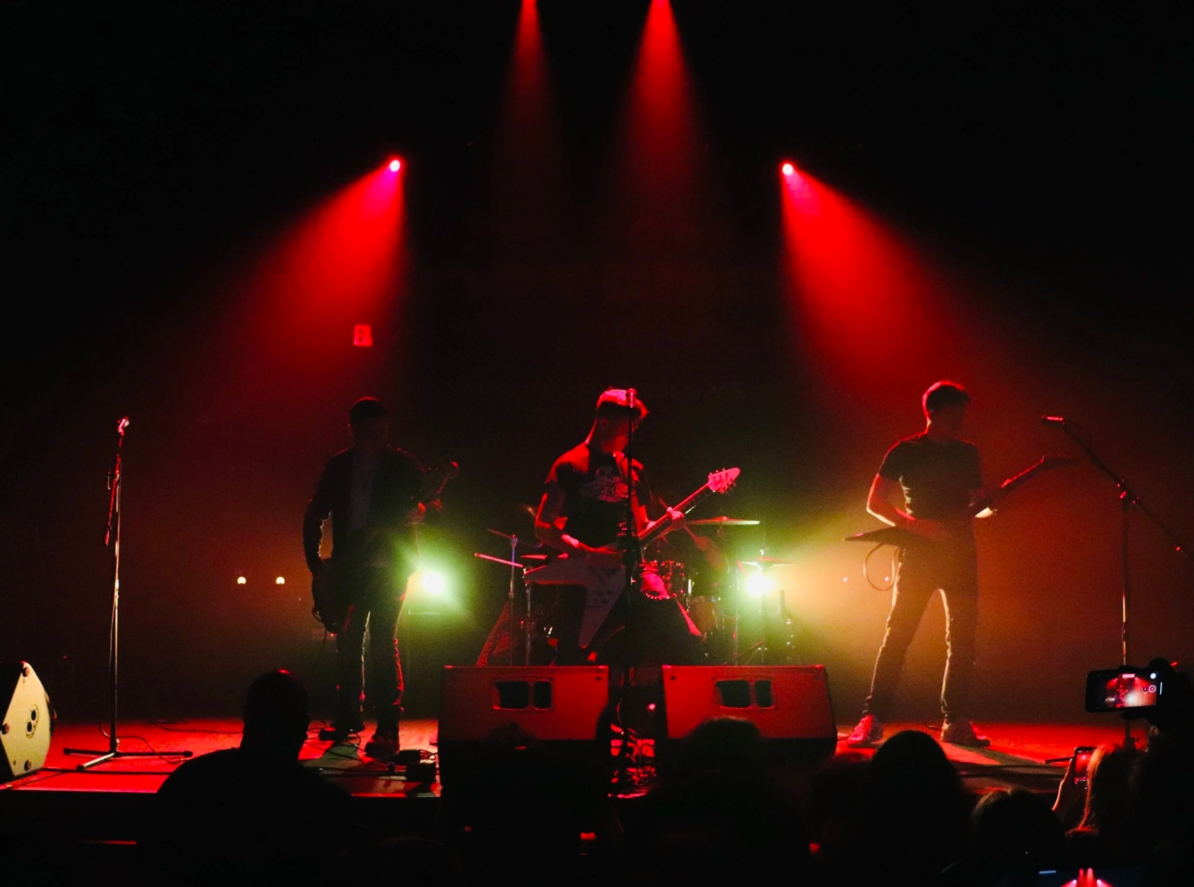 Mainline silhouette with stage lights coming from behind.