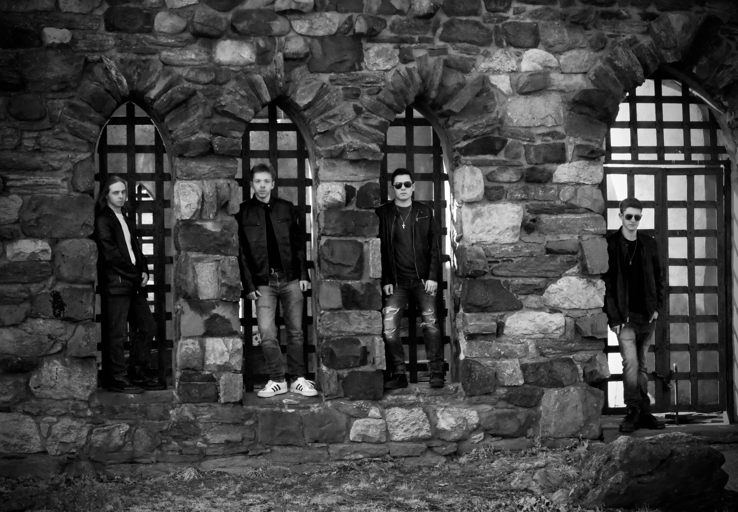 Mainline black and white promo shot with band in castle windows