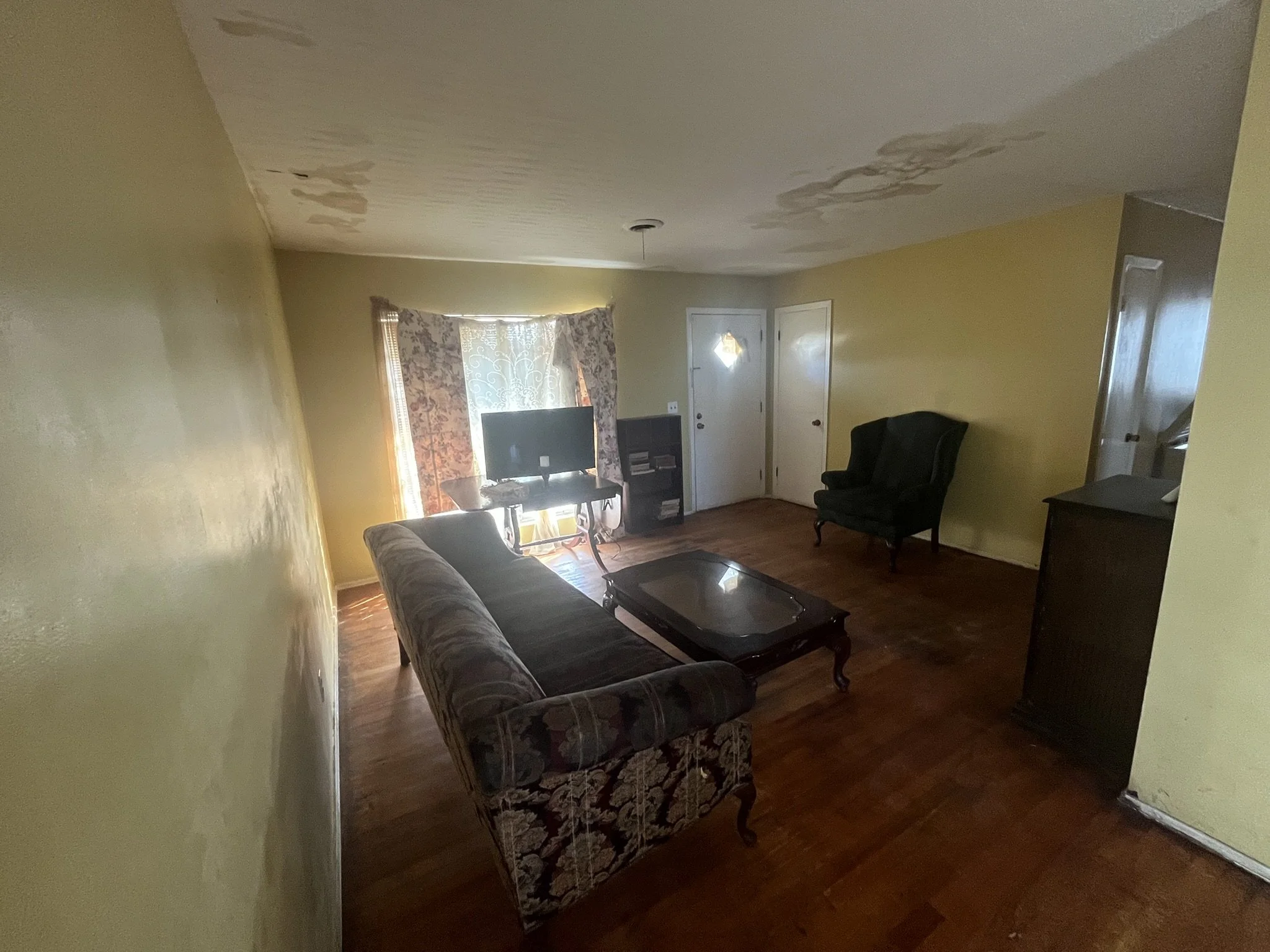 Before virtual staging of a living room we did for a client in Augusta, Georgia