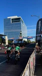 Bikers racing in the Aksarben Tirc Criterium with the HDR building in the background