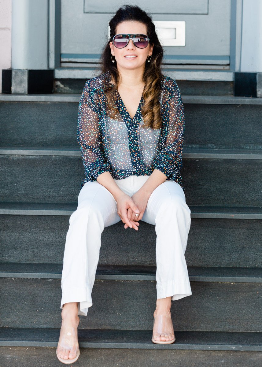 Creative personal stylist photographed on Notting Hill streets, relaxed lifestyle brand portrait for London fashion professional