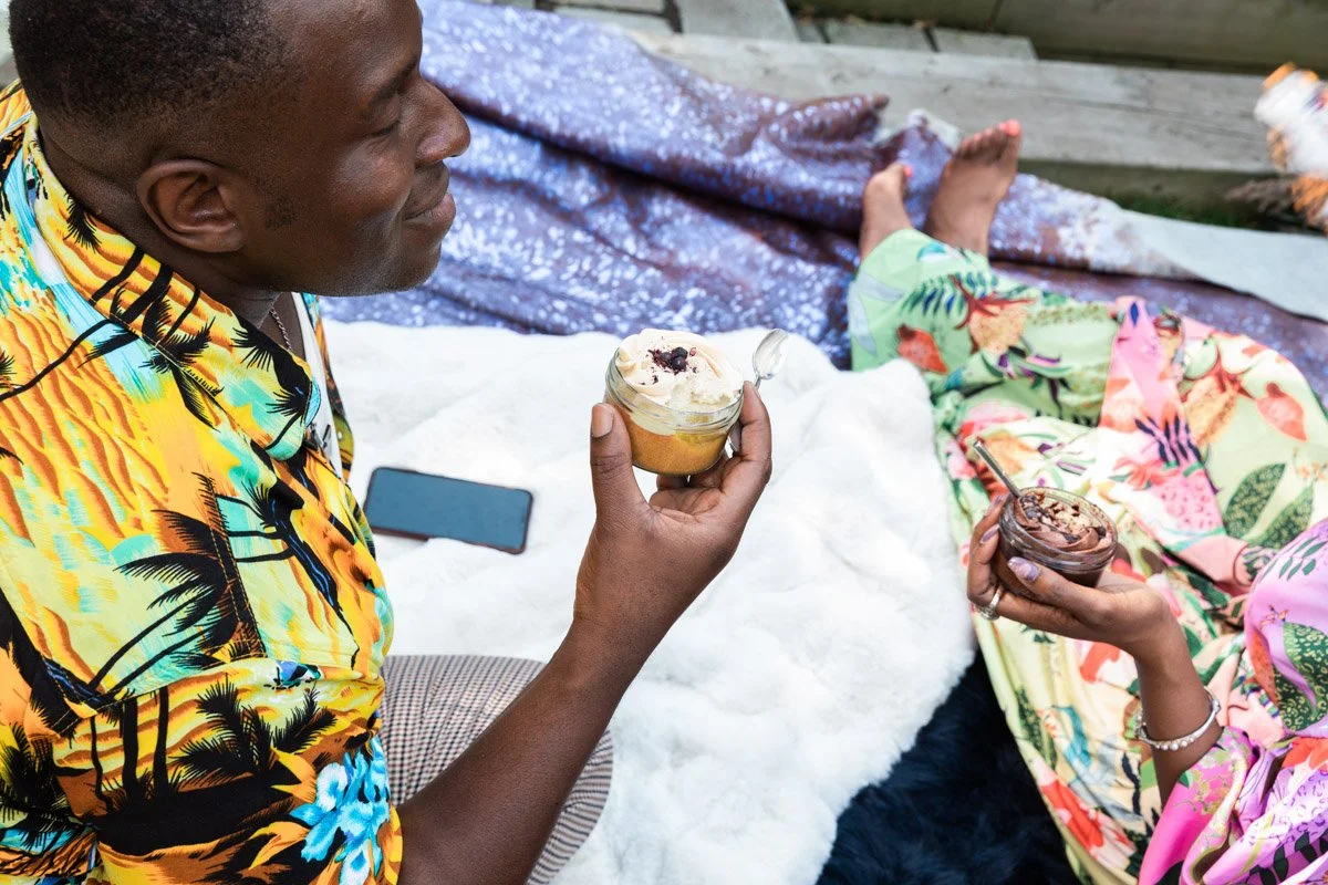 Model indulging in vegan free-from dessert lifestyle dessert photography in garden setting, playful and authentic brand imagery