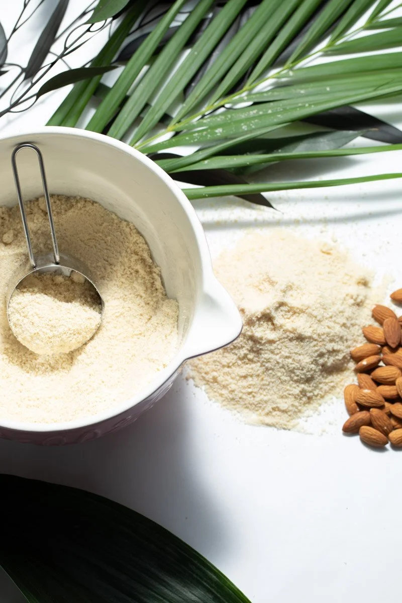 Free-from dessert ingredients styled at home, natural whole ingredients for gluten-free dairy-free mousse, playful flat lay photography