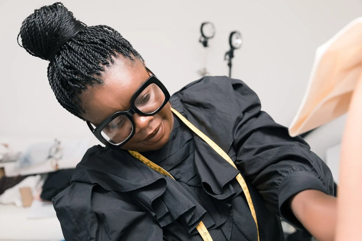 Female creative professional photographed in her workspace, editorial personal branding session London