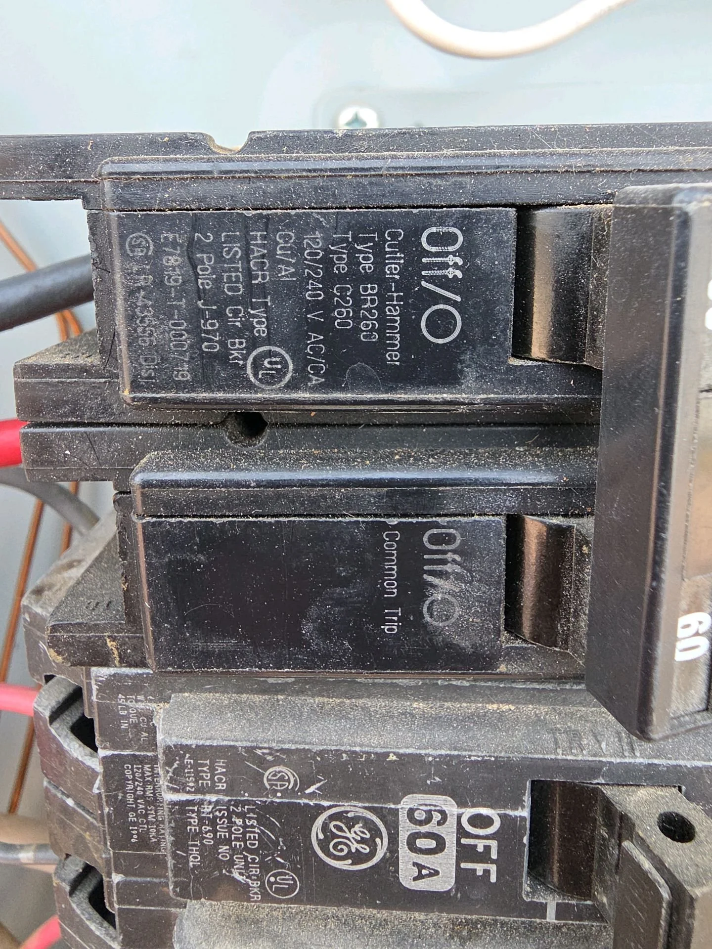 Close-up of electrical contactors with visible brand labels and technical information printed on them.