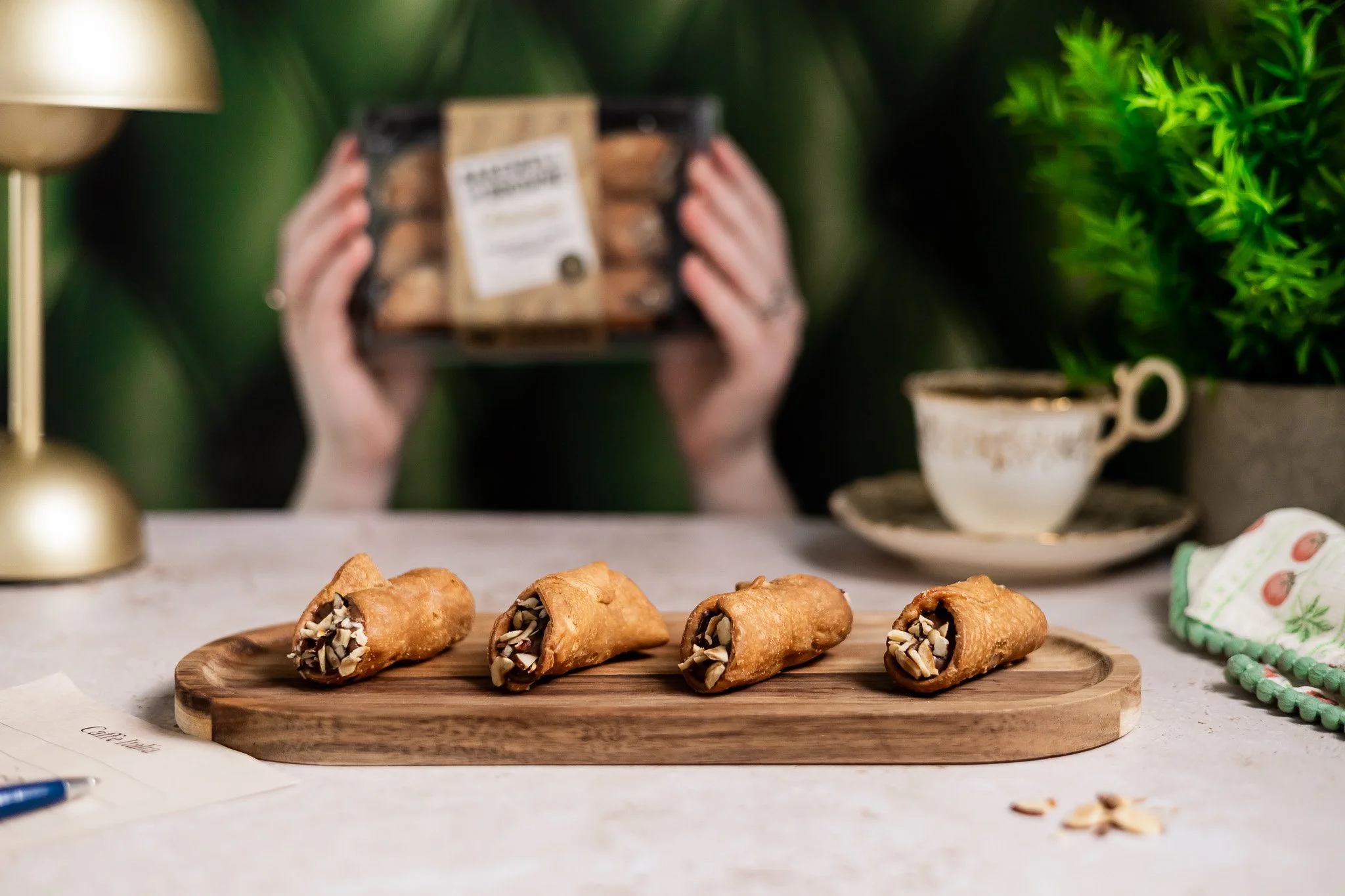 Professional food photographer capturing patisserie products at a restaurant by Lensbox Photography.
