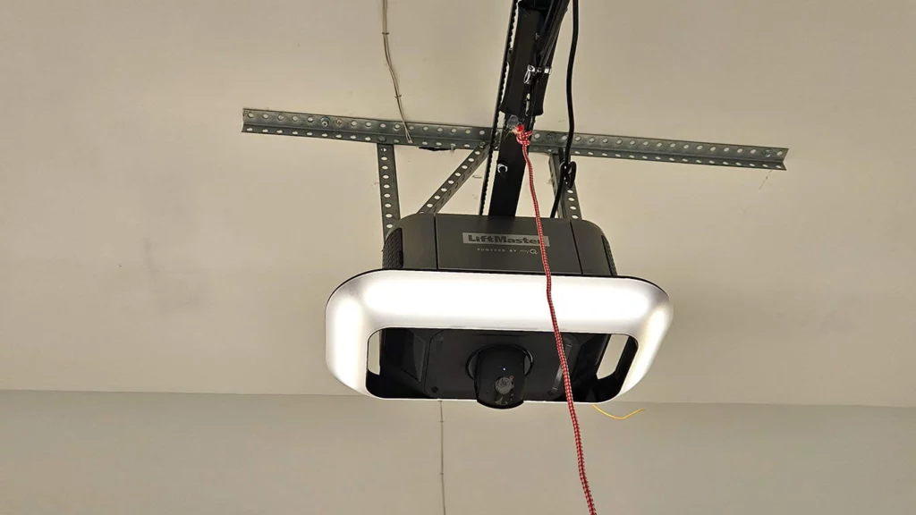Garage ceiling with a ceiling-mounted garage door opener and track system.