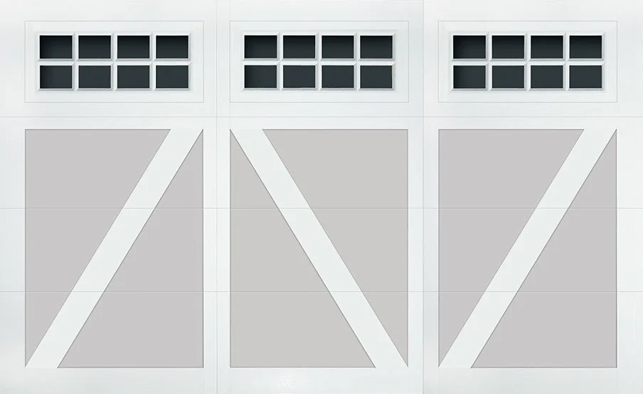 Garage door with three panels, each with small window panes at the top.