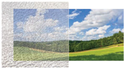 Comparison of a landscape with cloudy skies and a green field, showing before and after image quality enhancement.