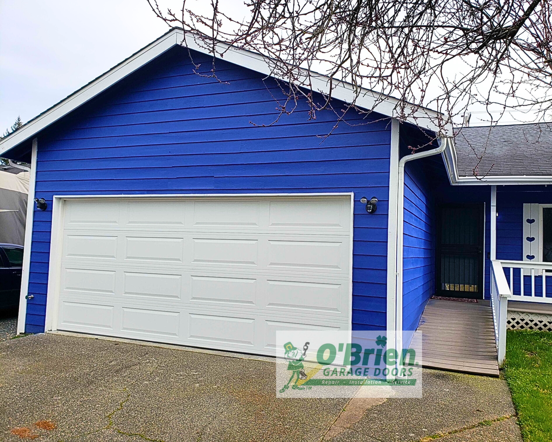 steel back fully insulated garage door northwest door model therma tech 128 long raised panel in white with no windows with vinyl trim and LiftMaster Chain Drive 8165w- 7