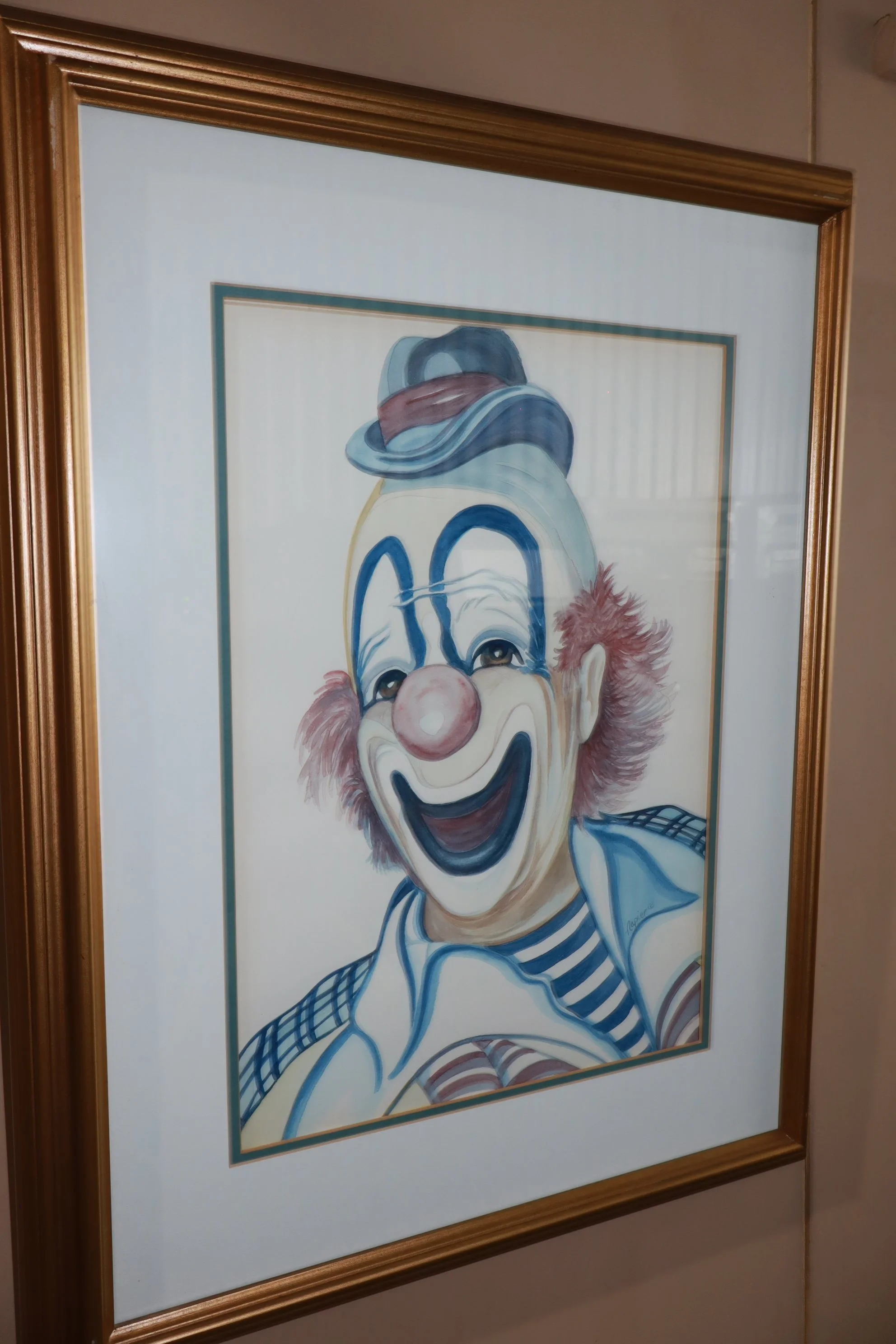 Vintage portrait of a smiling clown by Napier