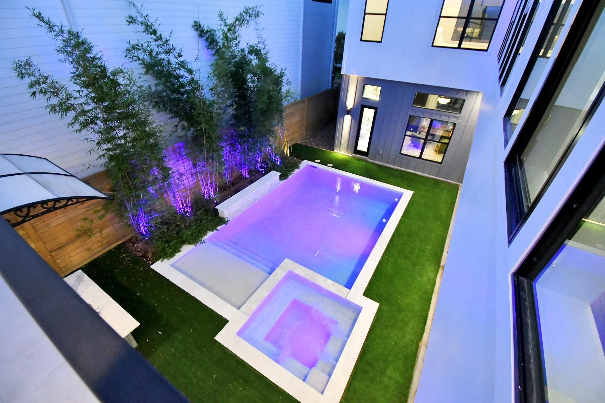 Private pool and jacuzzi with customizable remote-controlled lighting, creating a serene, resort-style ambiance day or night.