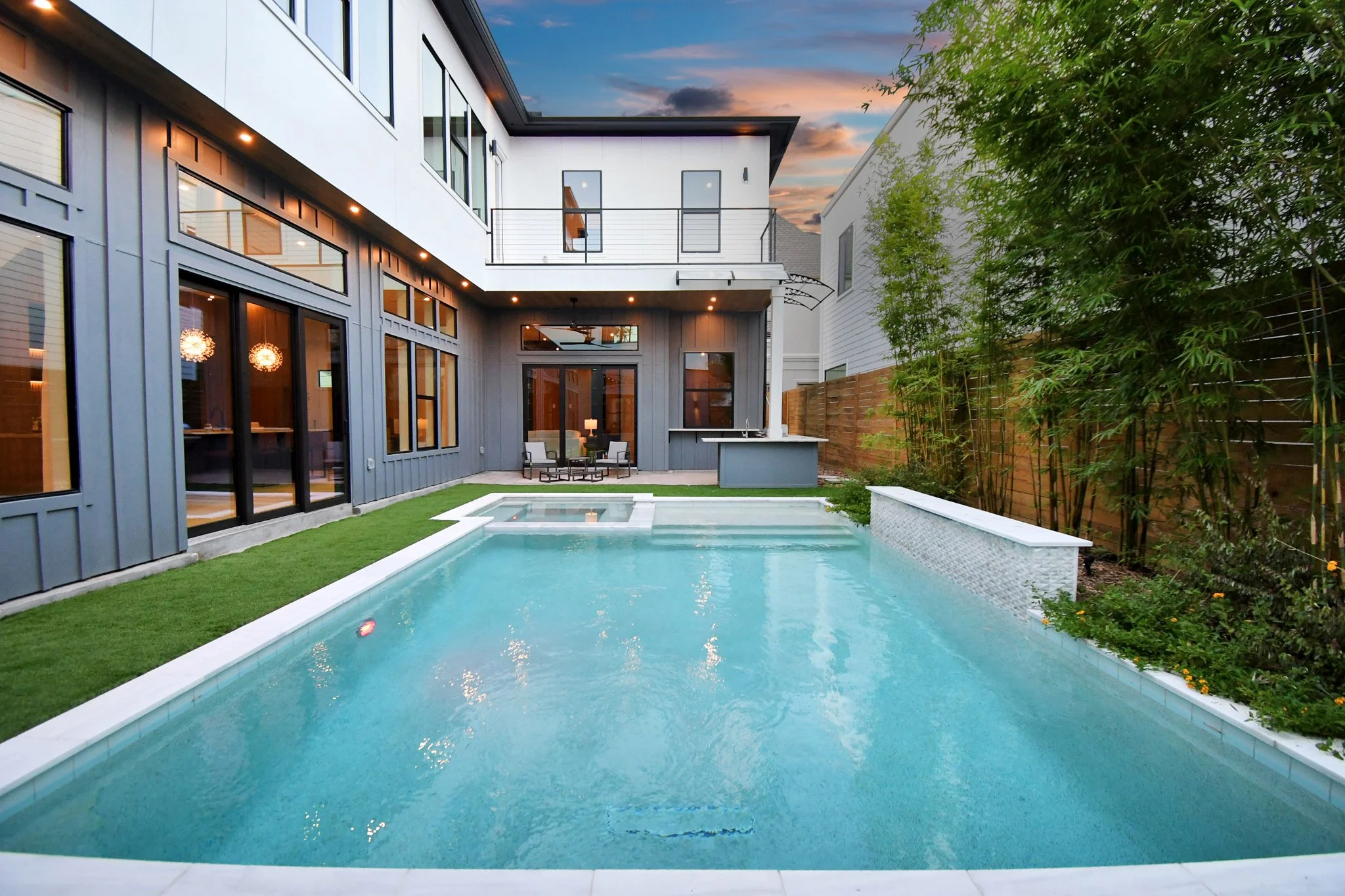 A private backyard retreat featuring a sleek pool, modern architecture, and serene landscaping—designed for elevated outdoor living and relaxation.