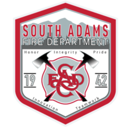 South Adams Fire Department emblem with fire department name, year 1942, and words Honor, Integrity, Pride, Innovation, and Teamwork.