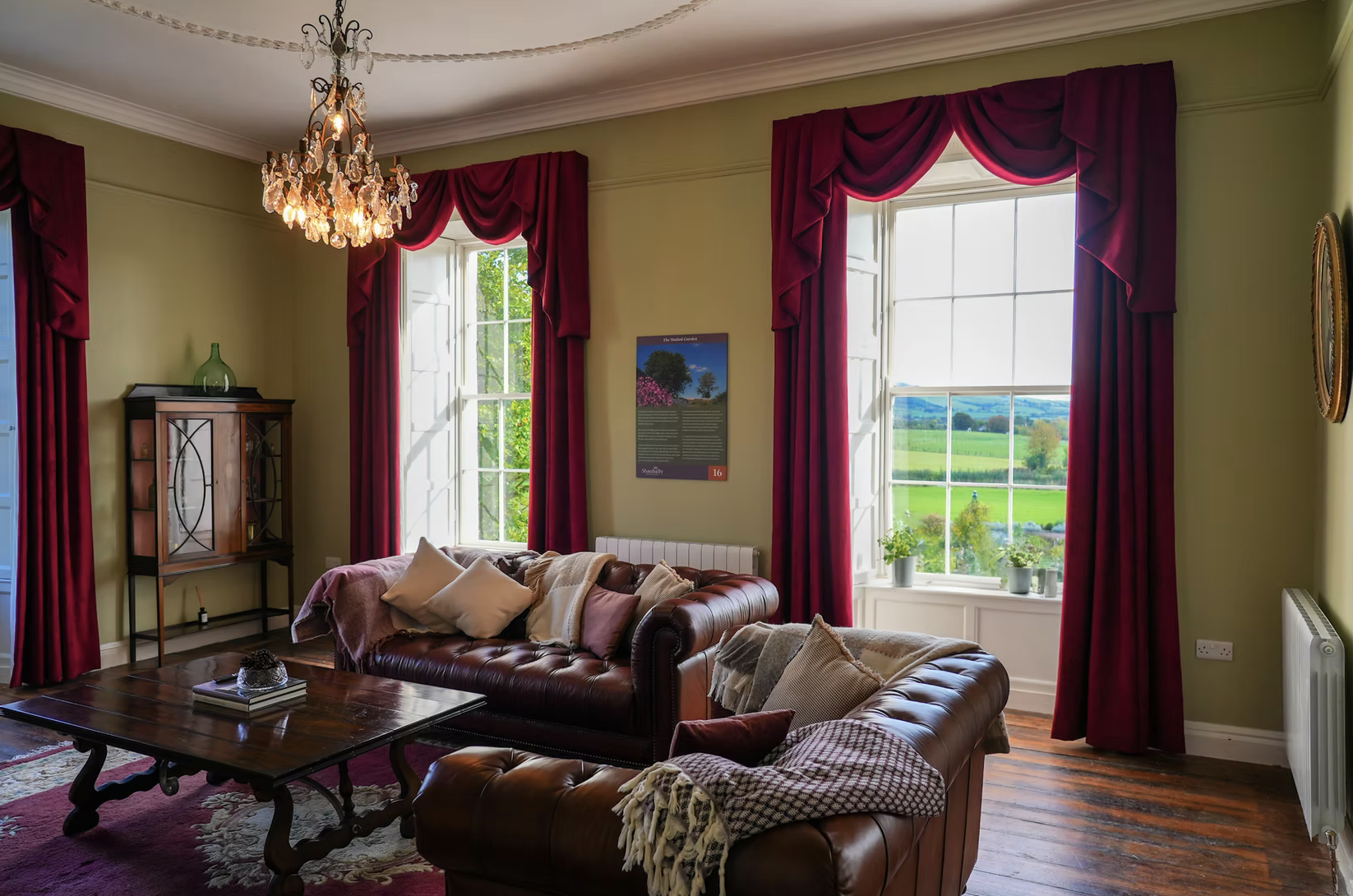 Gorgeous living room with leather couches and a fireplace relaxing vibe