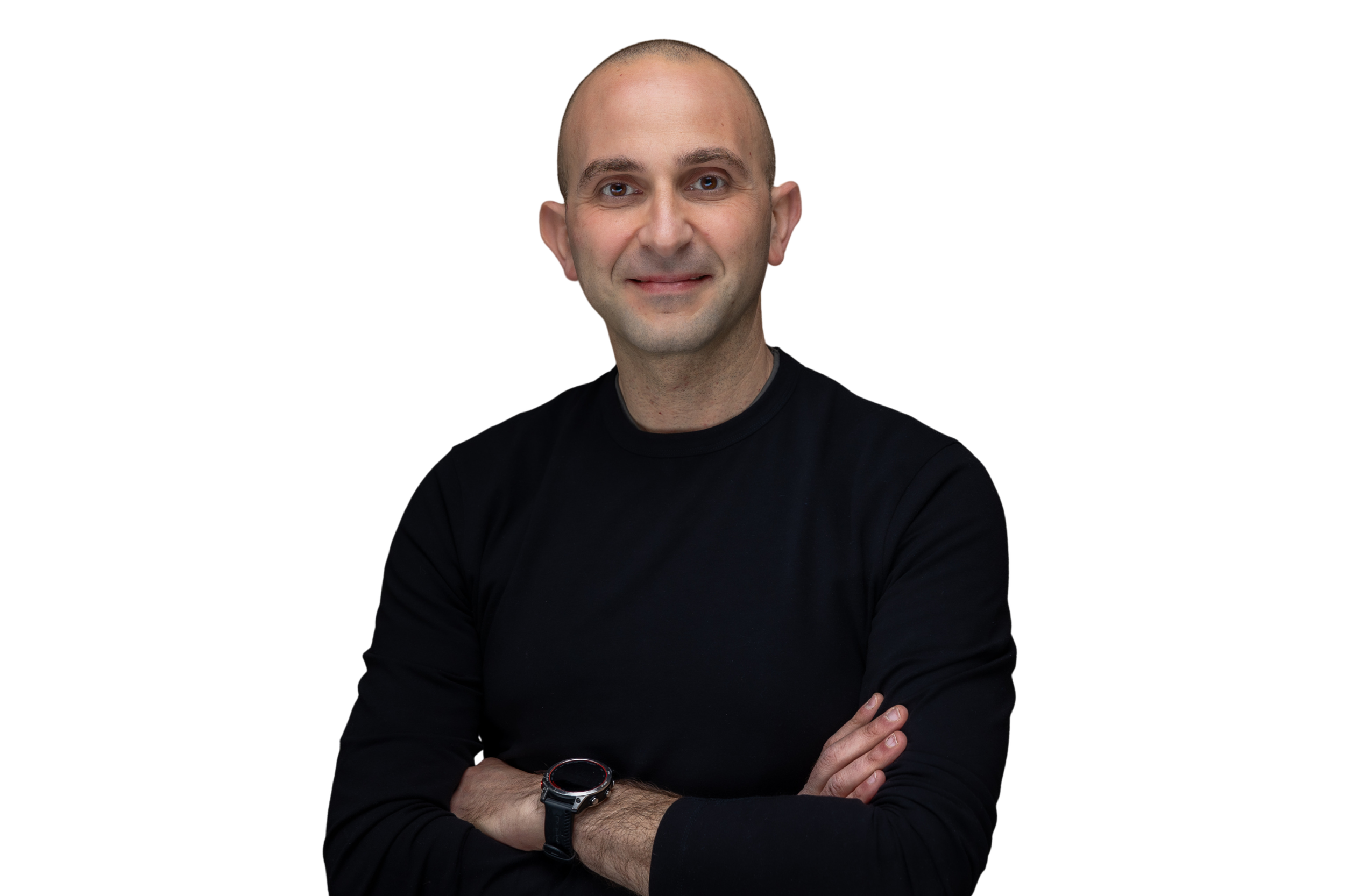 A man with a shaved head wearing a black long-sleeve shirt and a black watch on his wrist, standing with arms crossed against a white background. Wael Hanna President and CMO of NodeAI