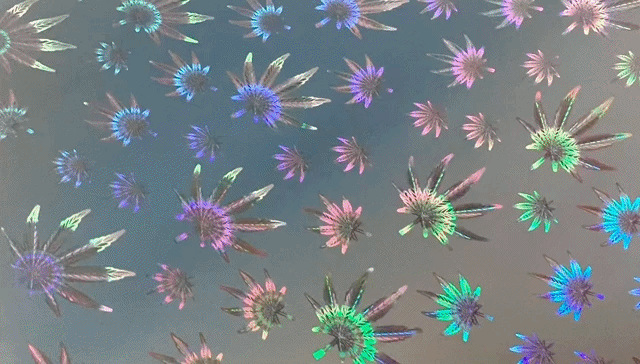 A close up of a unique fireworks inspired holographic pattern offered by Mainline Holographics.