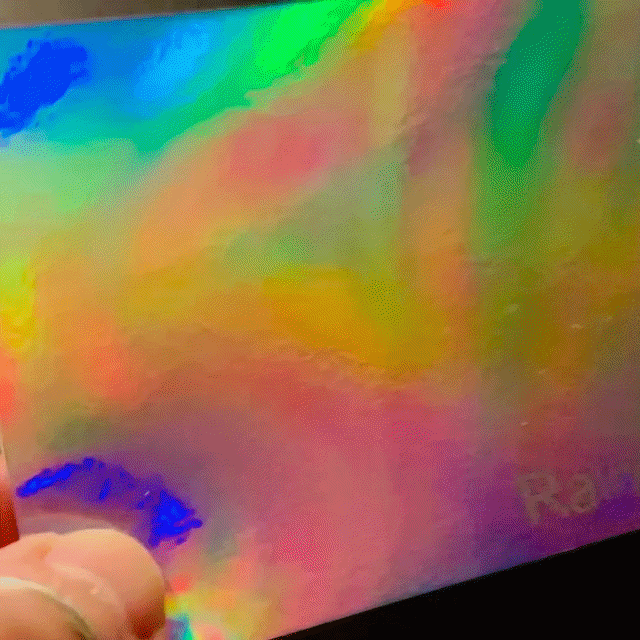 A close up shot of the rainbow holographic pattern in motion offered by Mainline Holographics.