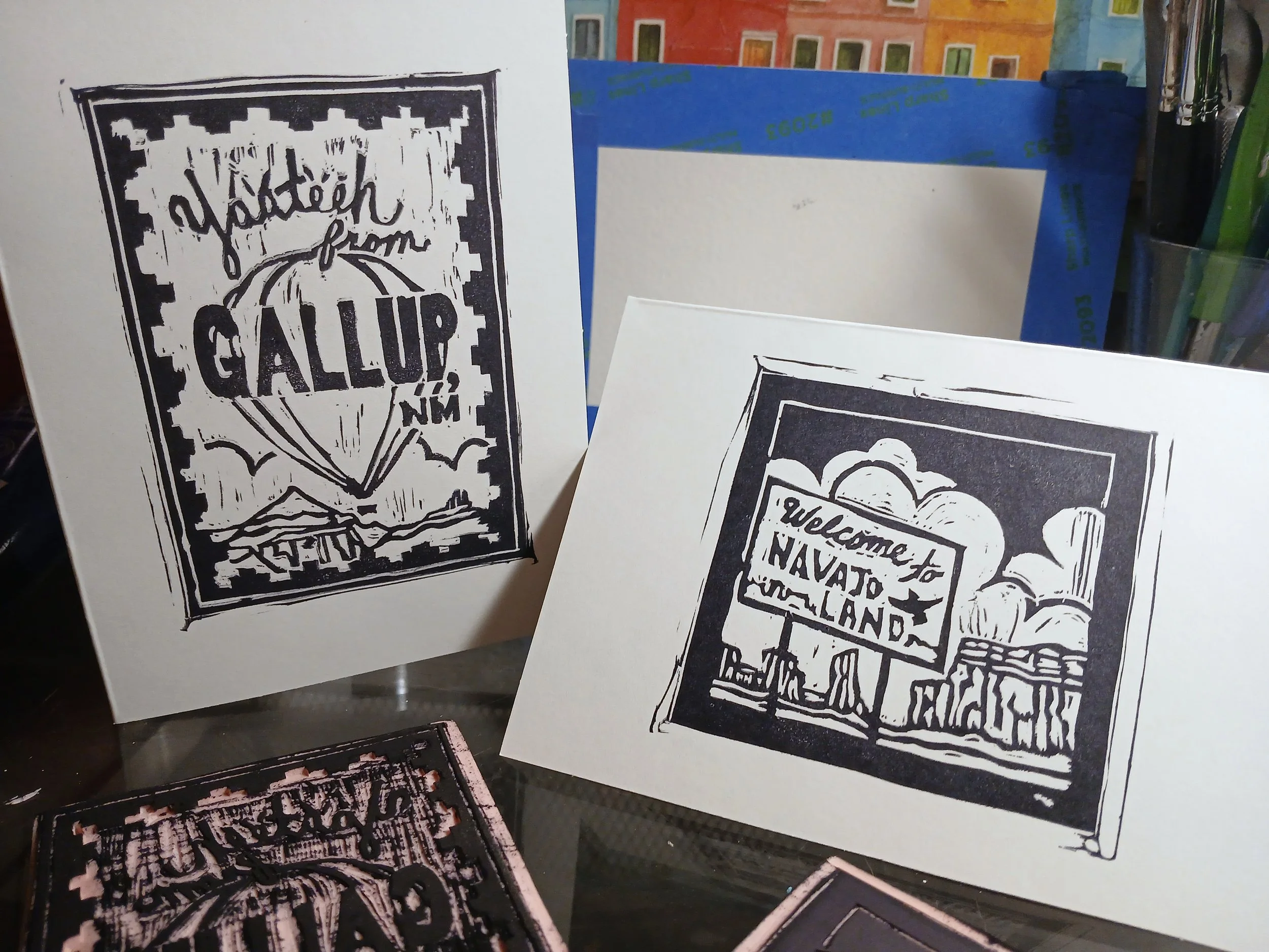 A pair of hand carved blocks printed onto greeting cards.