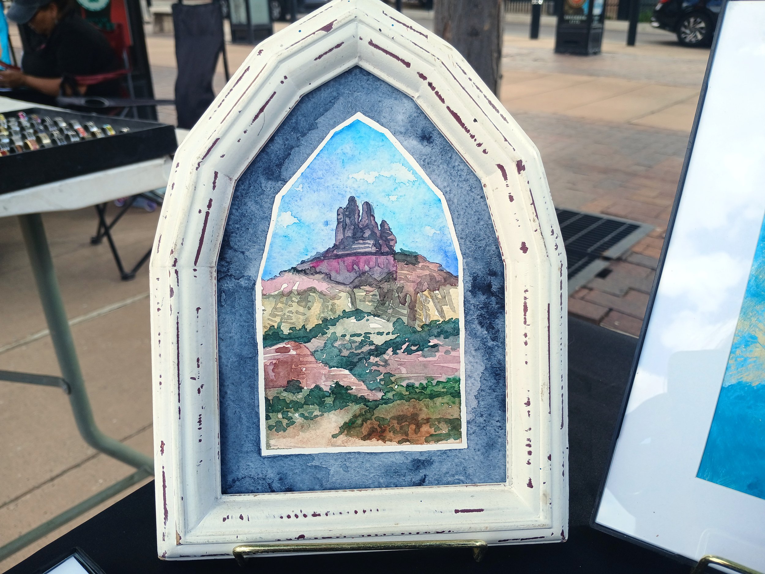 A watercolor featuring Churchrock, a popular hiking trail east of Gallup, a favorite of locals and tourists alike. Sold during the Gallup Summer Dance Series at the Gallup Courthouse Square.