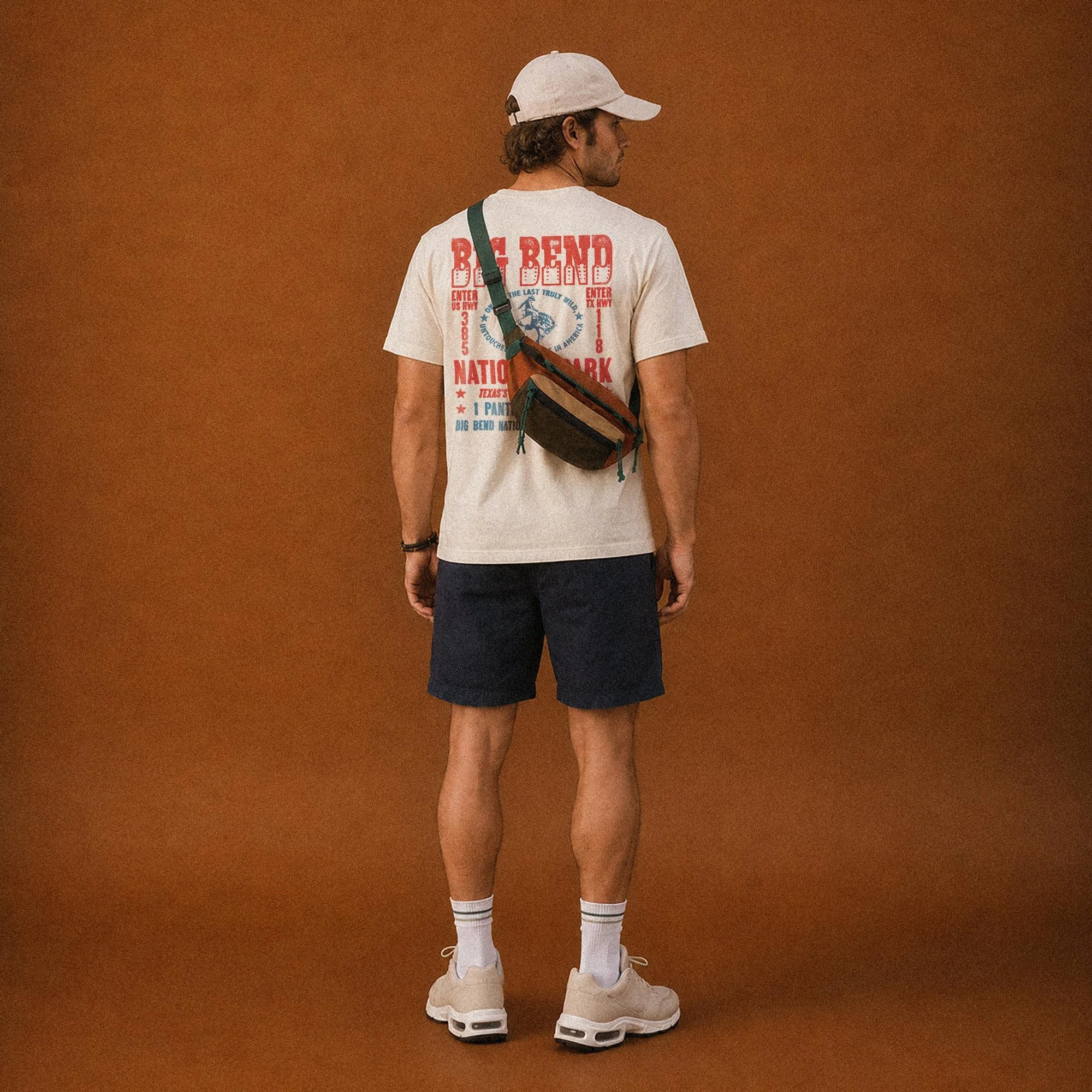 a man wearing a printed big bend t-shirt