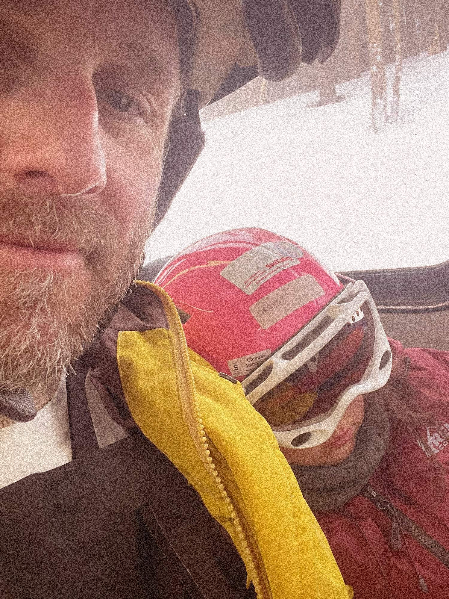Father and daughter riding the bus home from the lifts in Mammoth CA