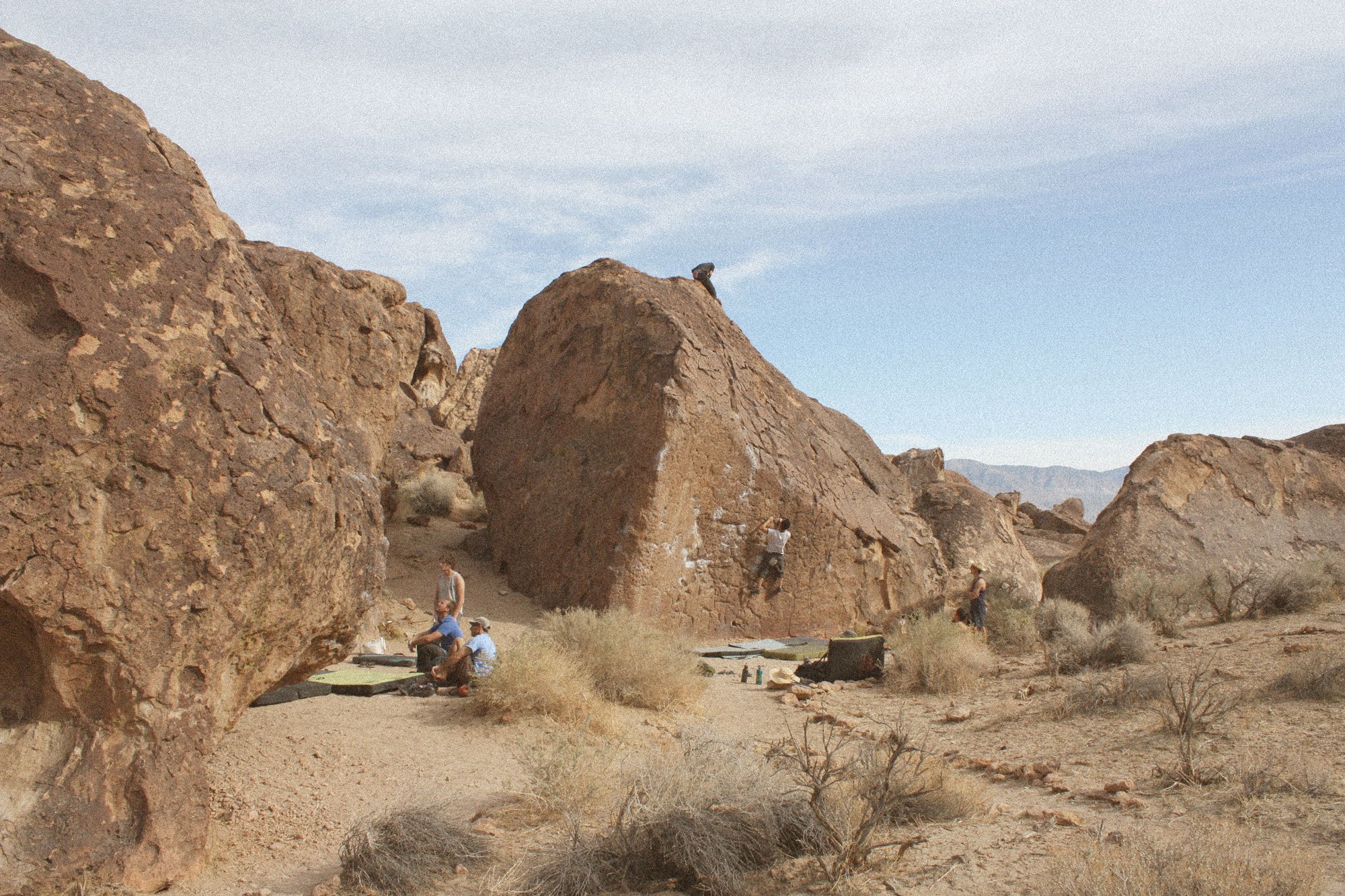 Climbers bouldering at The Buttermilks in Bishop, CA