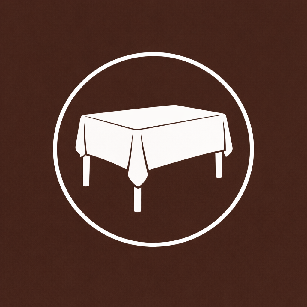 Icon of a dining table with a tablecloth, enclosed in a white circle