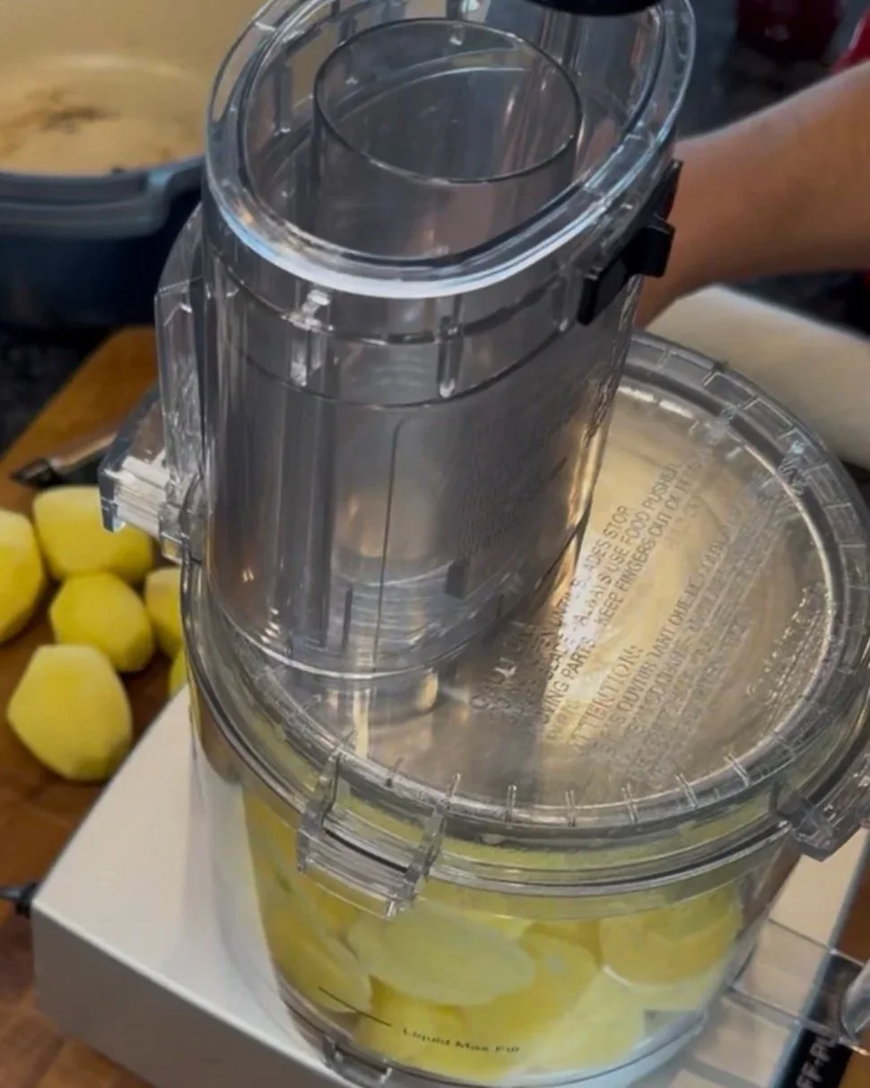 Slicing potatoes thin in a food processor for Pommes Anna