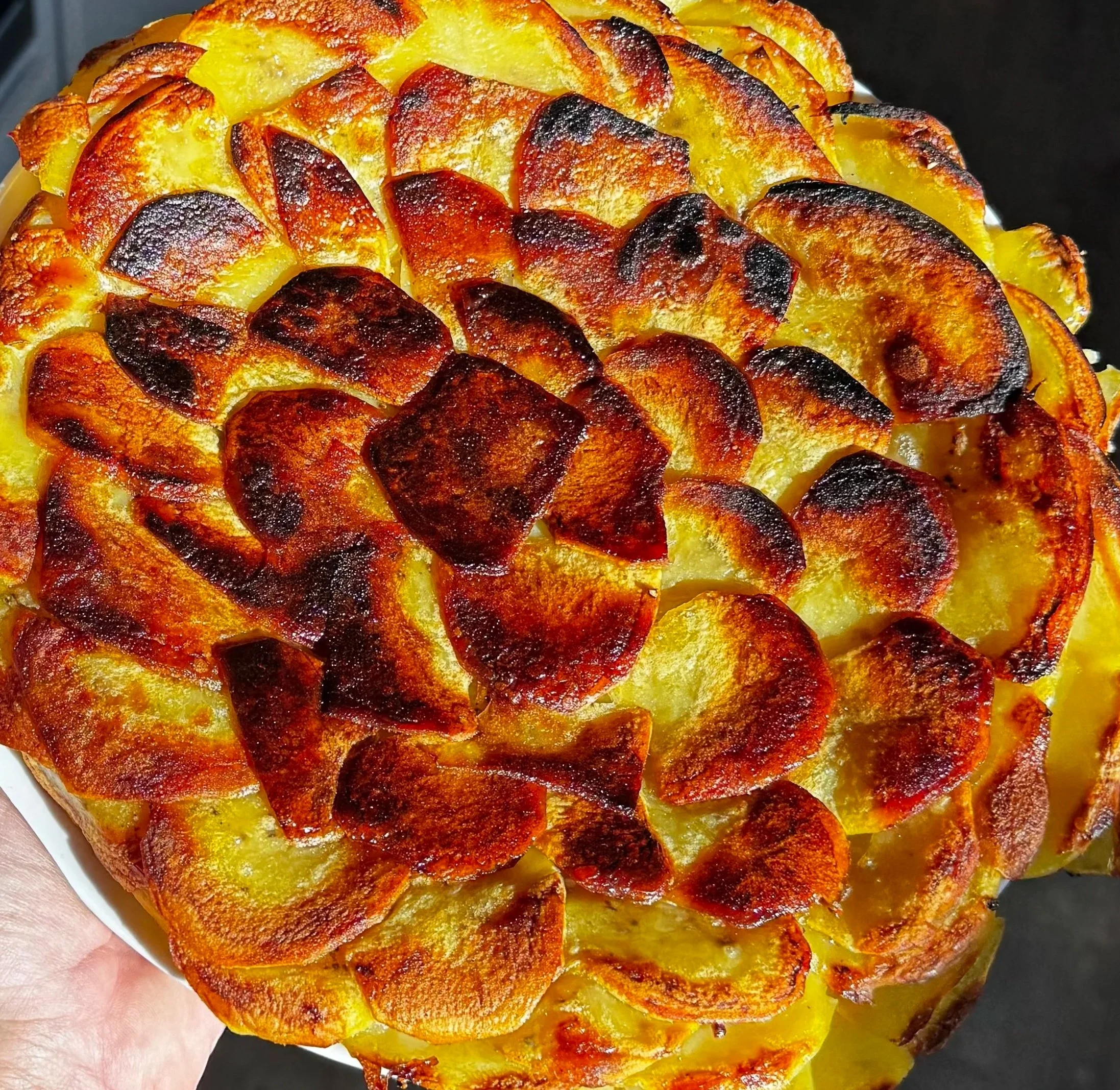 Pommes Anna with golden caramelized crust, fresh from the oven at Whiskey Ridge.