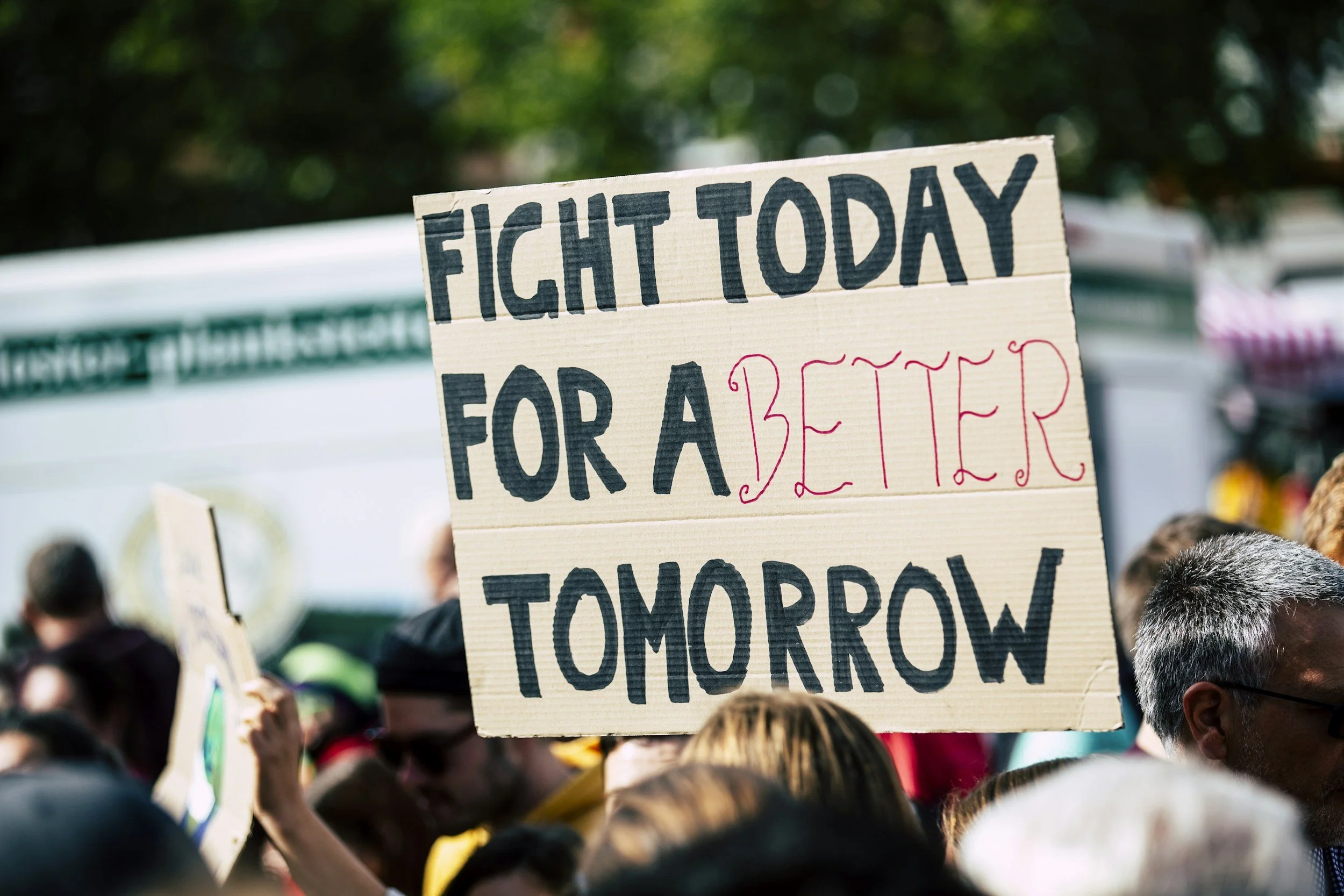 group of people holding signs at a march