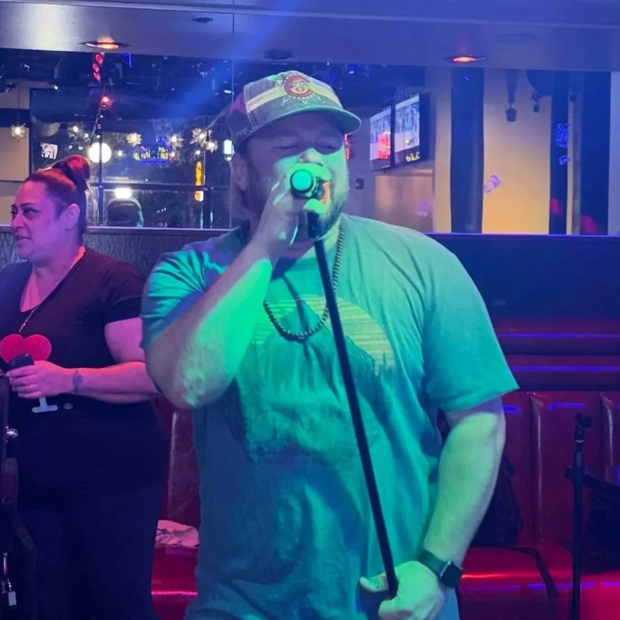 man singing on a microphone