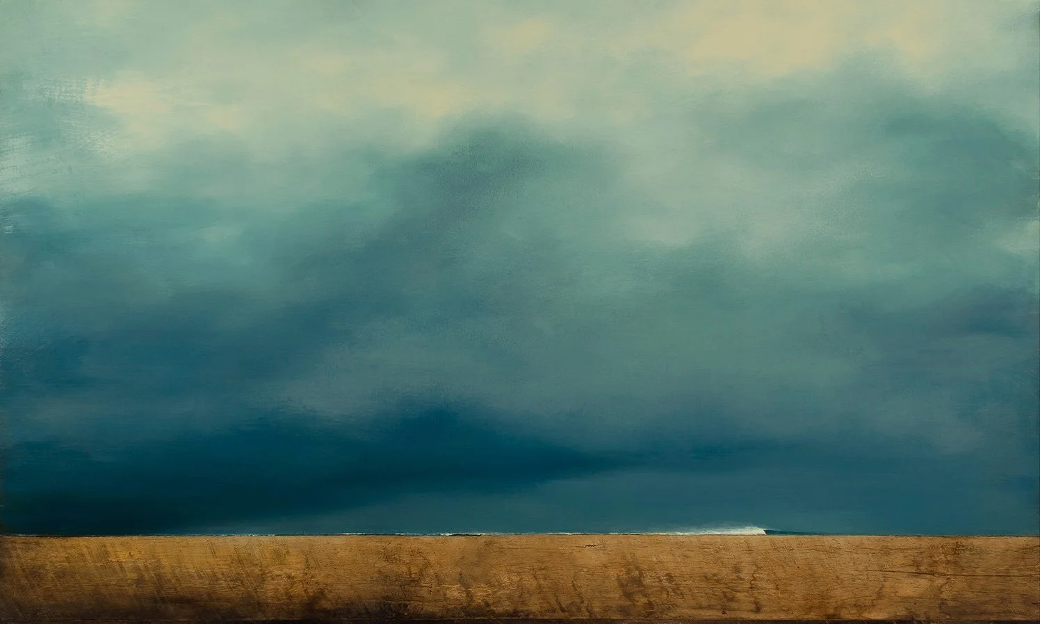 Overcast sky with dark clouds over a wooden surface on the ground.