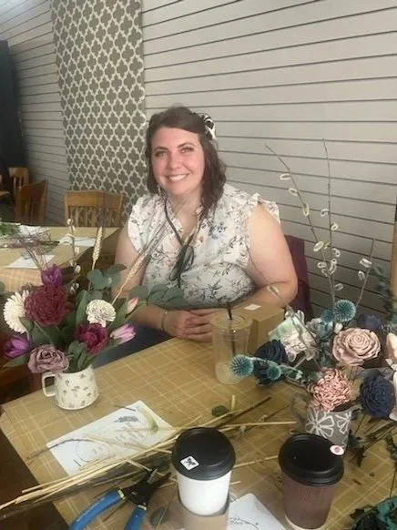 A picture of owner  at a make and take workshop