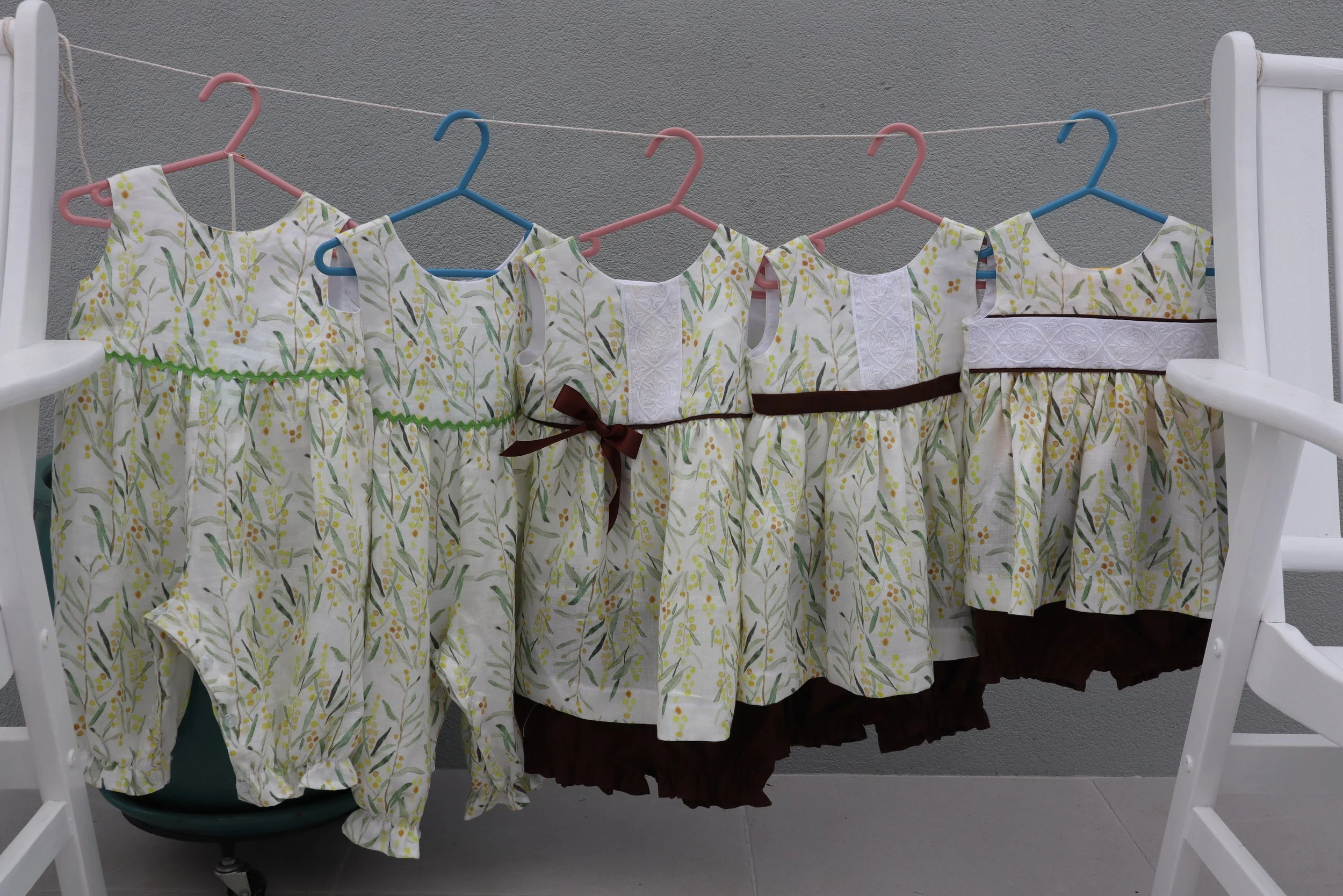 Linen oncies and tops and bottoms front.JPG