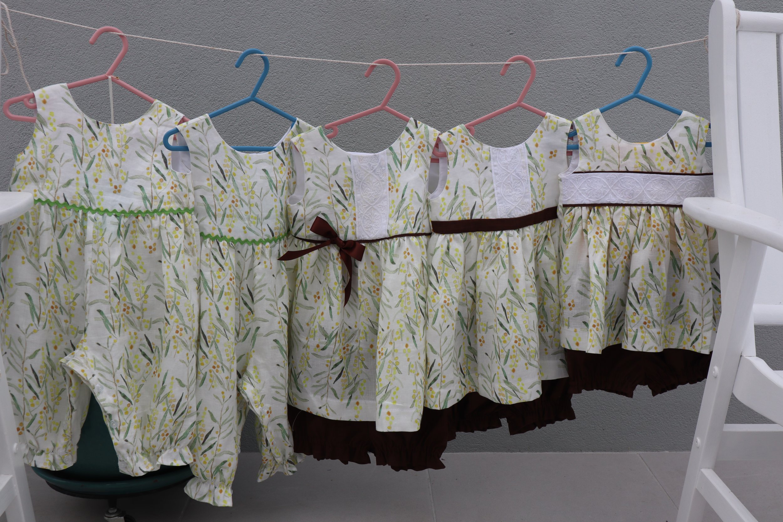 Linen oncies and tops and bottoms all fronts.JPG