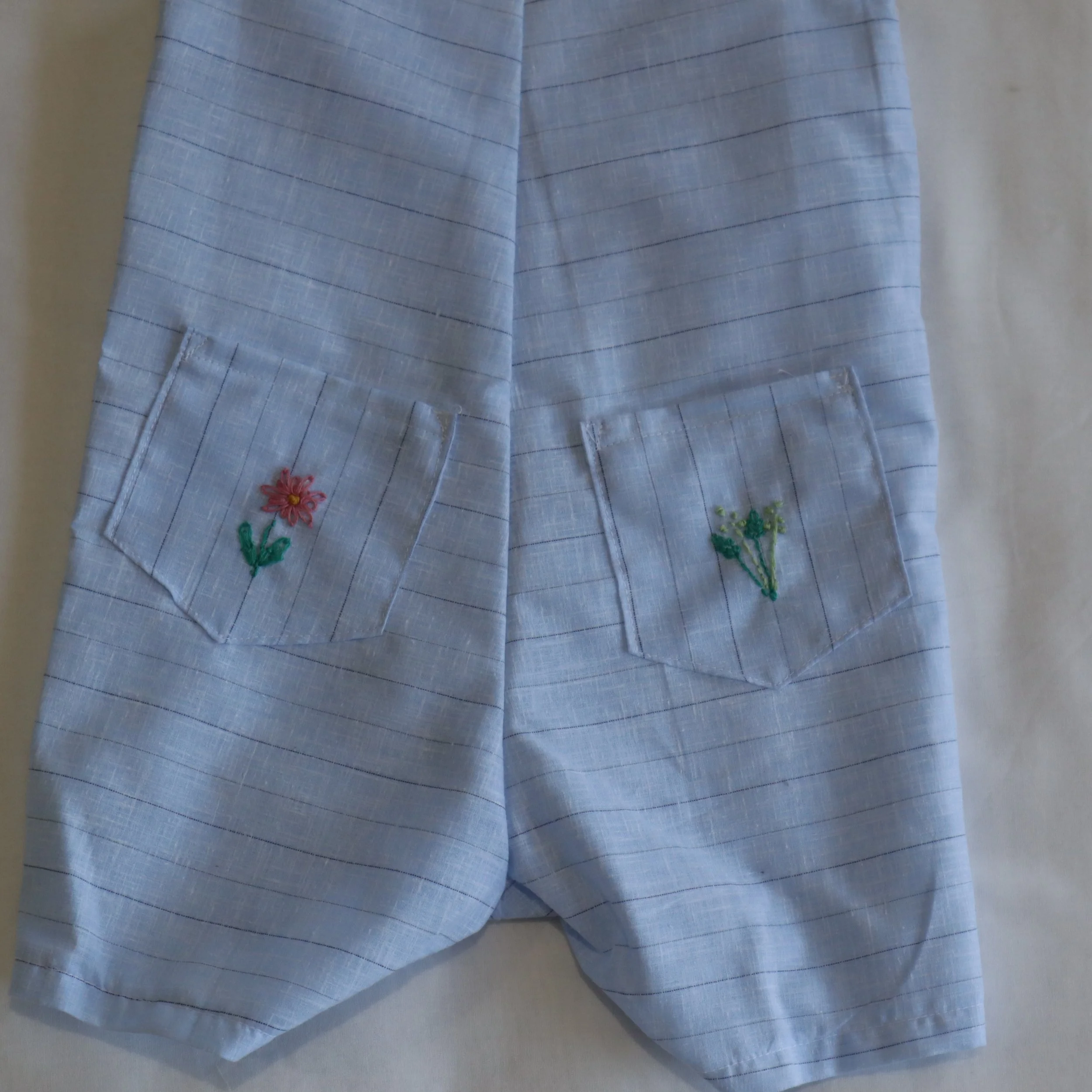 Cow embroided overall medium back pockets.JPG