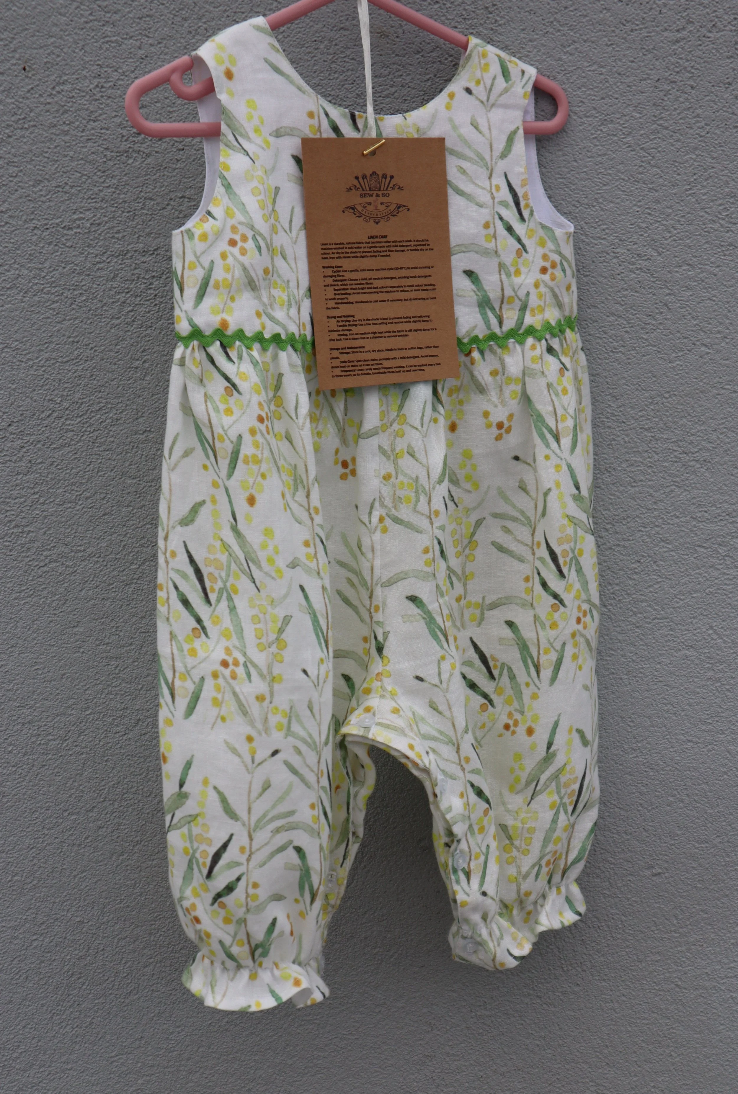 Linen oncie front with tag.JPG