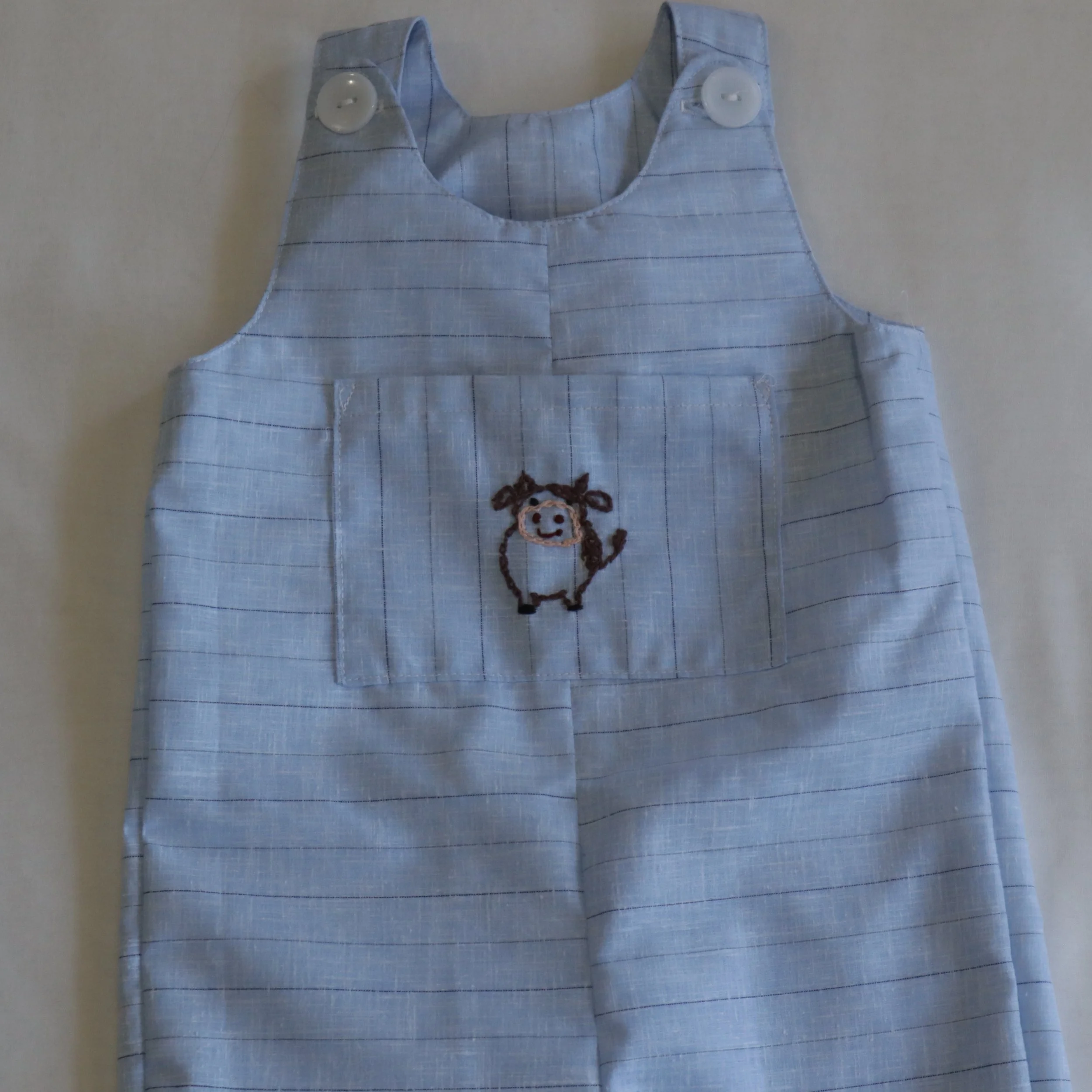 Cow embroided overall medium front pocket.JPG