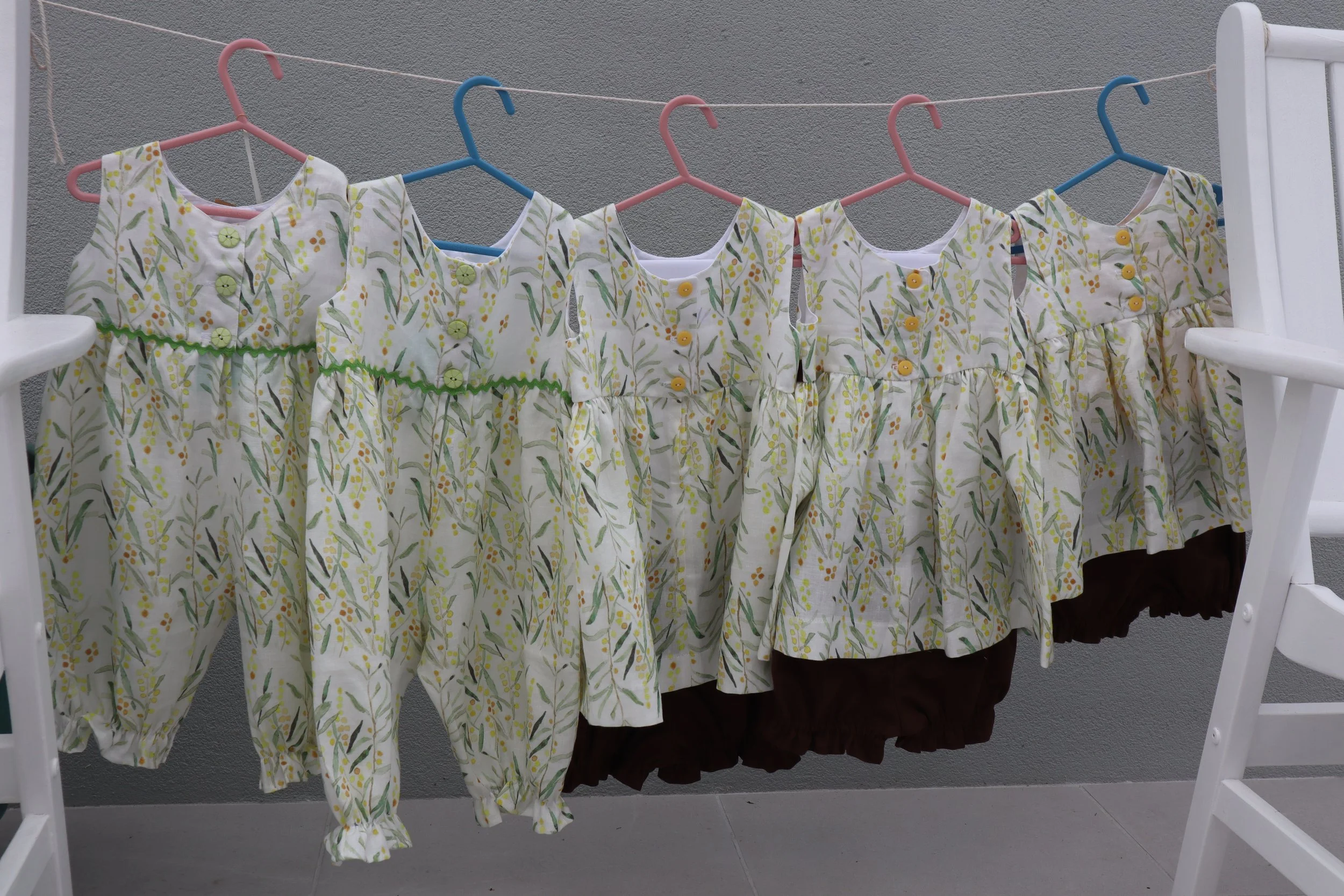 Linen oncies and tops and bottoms backs all.JPG