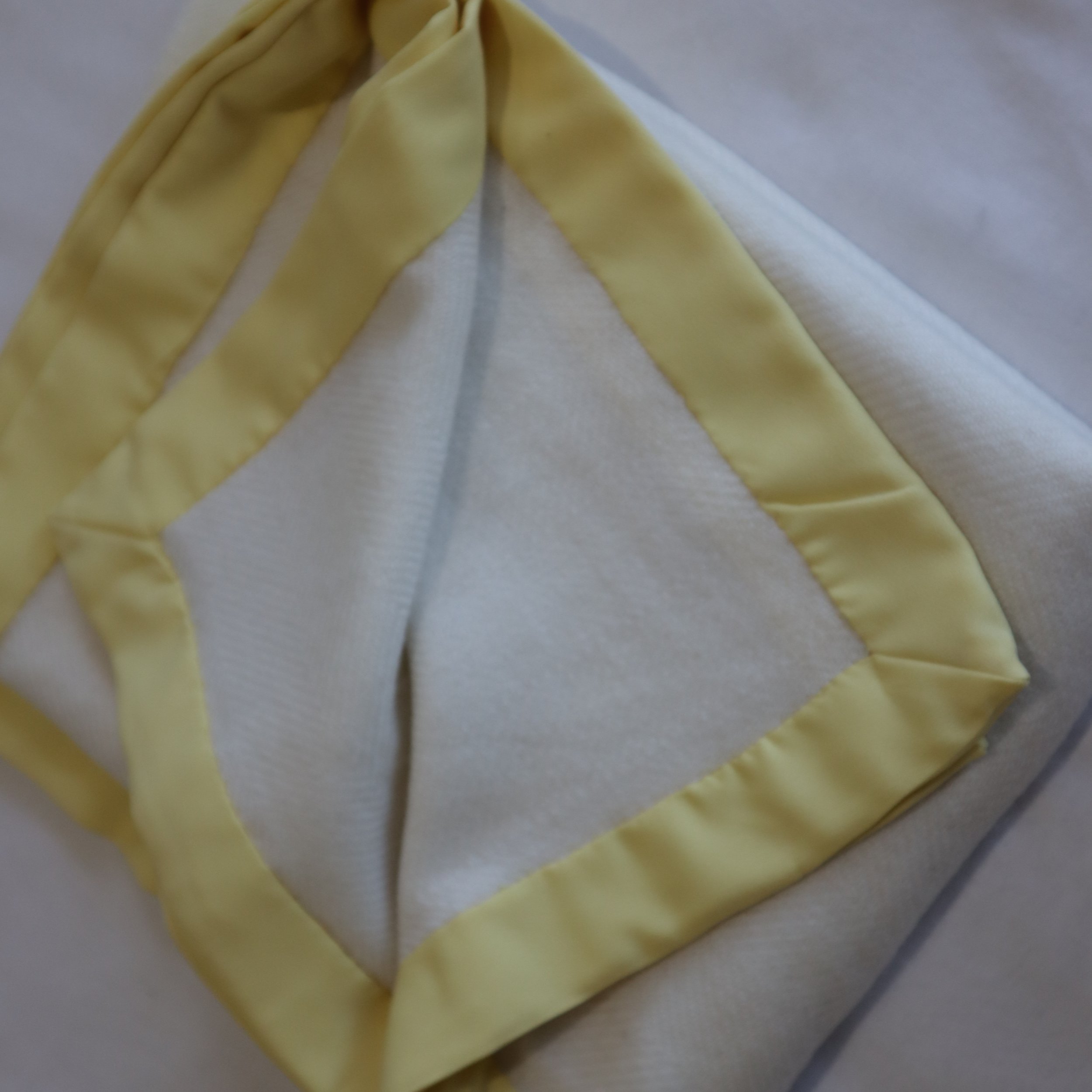Cashmere cream toddler blanket and yellow border.JPG